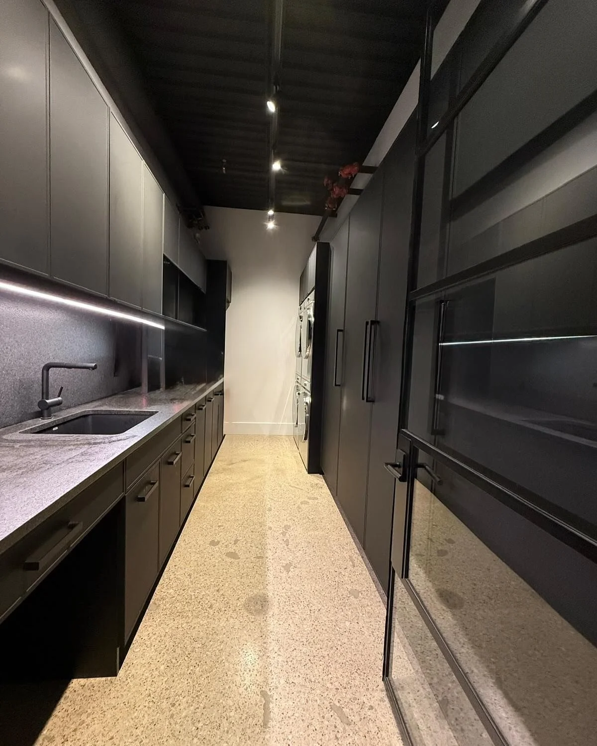 Who said chores can&rsquo;t be chic? This ultra-modern laundry room is serving high-end hotel vibes&mdash;because even your socks deserve a 5-star experience.

Sleek custom cabinetry, seamless built-ins, and a minimalist aesthetic make this space as 