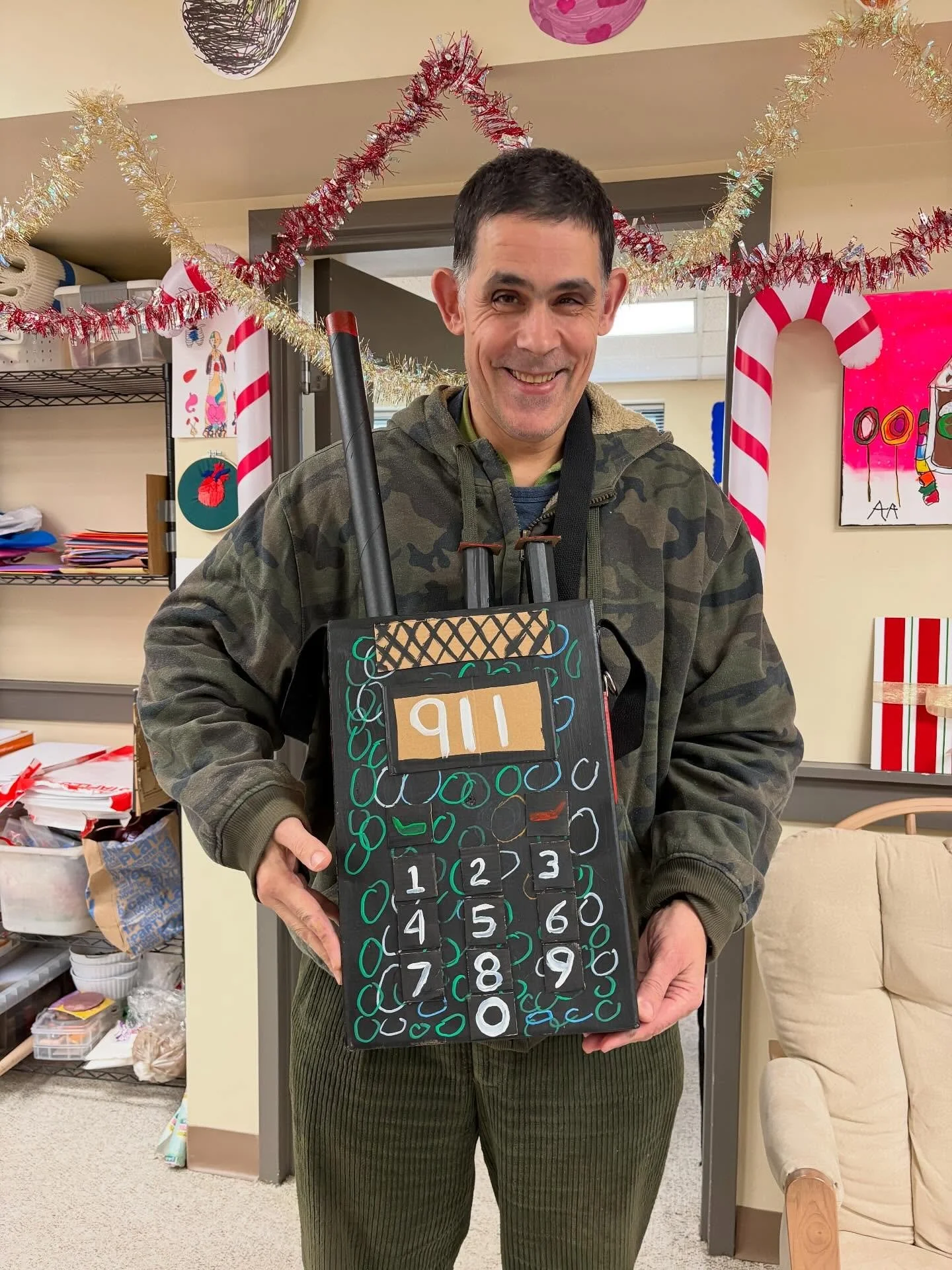 Folks from @avatar_community_center have been keeping busy! 
Slide 1 - Ron with a cardboard police radio he made with Chuck. 
Slide 2 - Dennis with a portrait of Kevin from Home Alone. 
Slide 3 - Xan working with tempura paint sticks on a winter scen