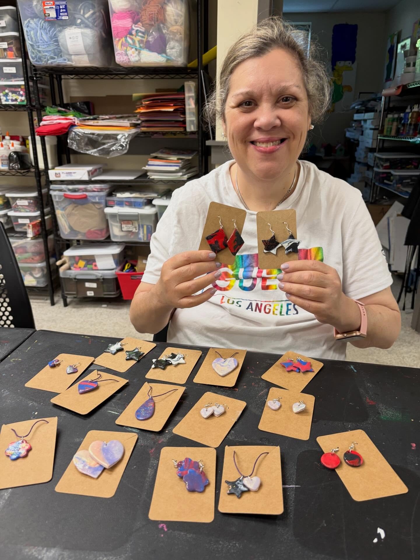 More artists at work!
1. Kim is making clay jewelry to sell at the Avatar Picnic! $5 a piece. She will be selling earrings, necklaces, bracelets and more. 
2. Cass is working on an embroidery &ldquo;E&rdquo; in Celtics colors.
3. Lizzy is drafting a 