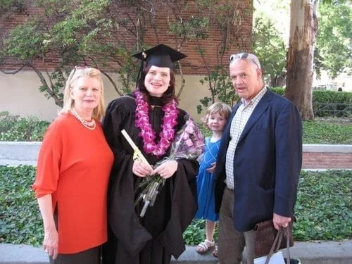 After I retired from acting, I got an MFA in Screenwriting from UCLA. This is me on graduation day with my parents and my daughter Ellie, age 3 here. (And our son Rex is also in the photo, in utero!)