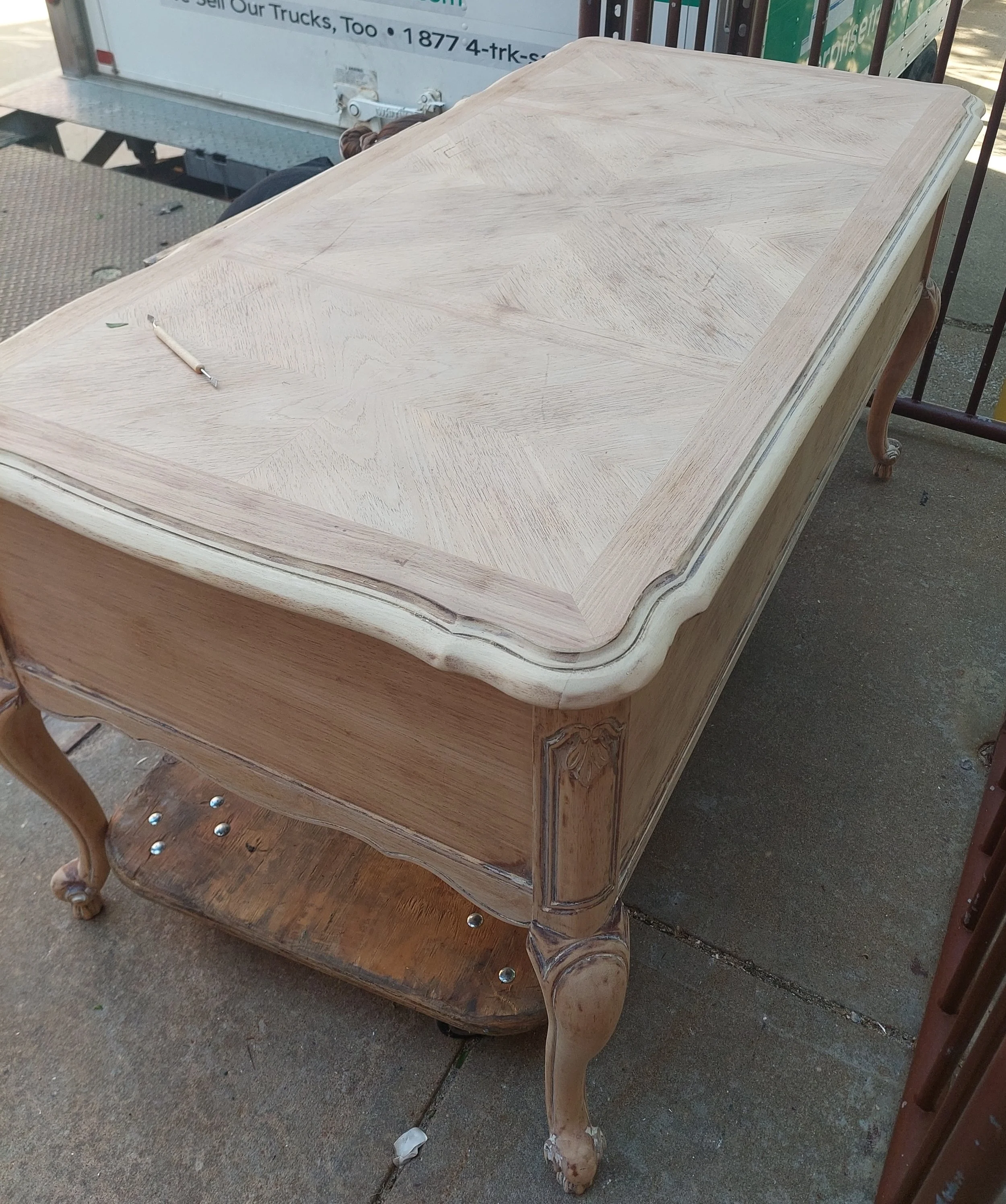 Final sanding step, using palm sander for flat surfaces and Dremel for the tight curved surfaces. Assisted by L. Miller.