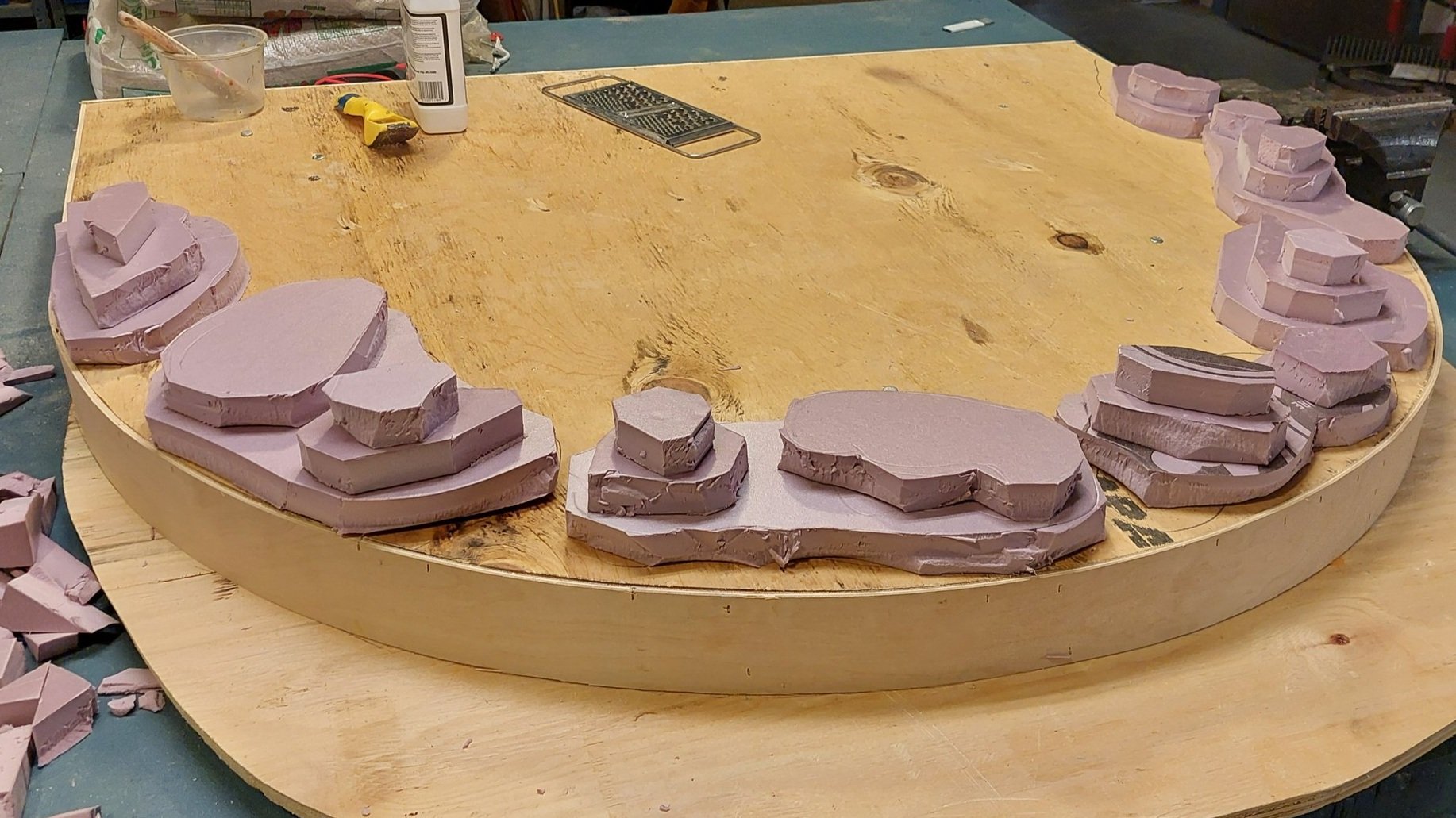 Base wagon for a large cauldron, meant to look like a raised rock. Wagon was built by the scenic team, and then foam was used to style out the rocks.