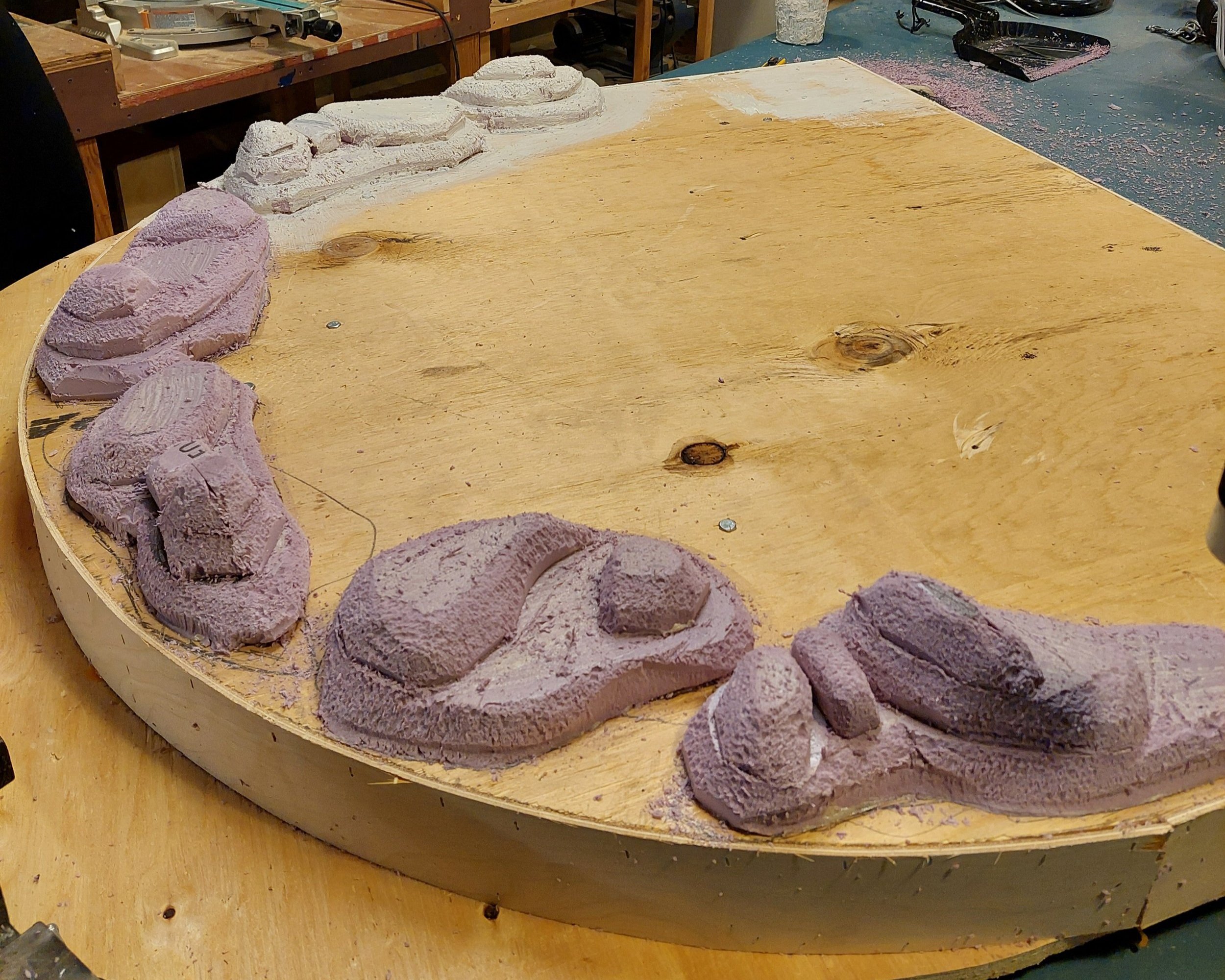 The foam shapes were then glued, trimmed, sanded and coated with cheesecloth and a special thickened paint treatment.