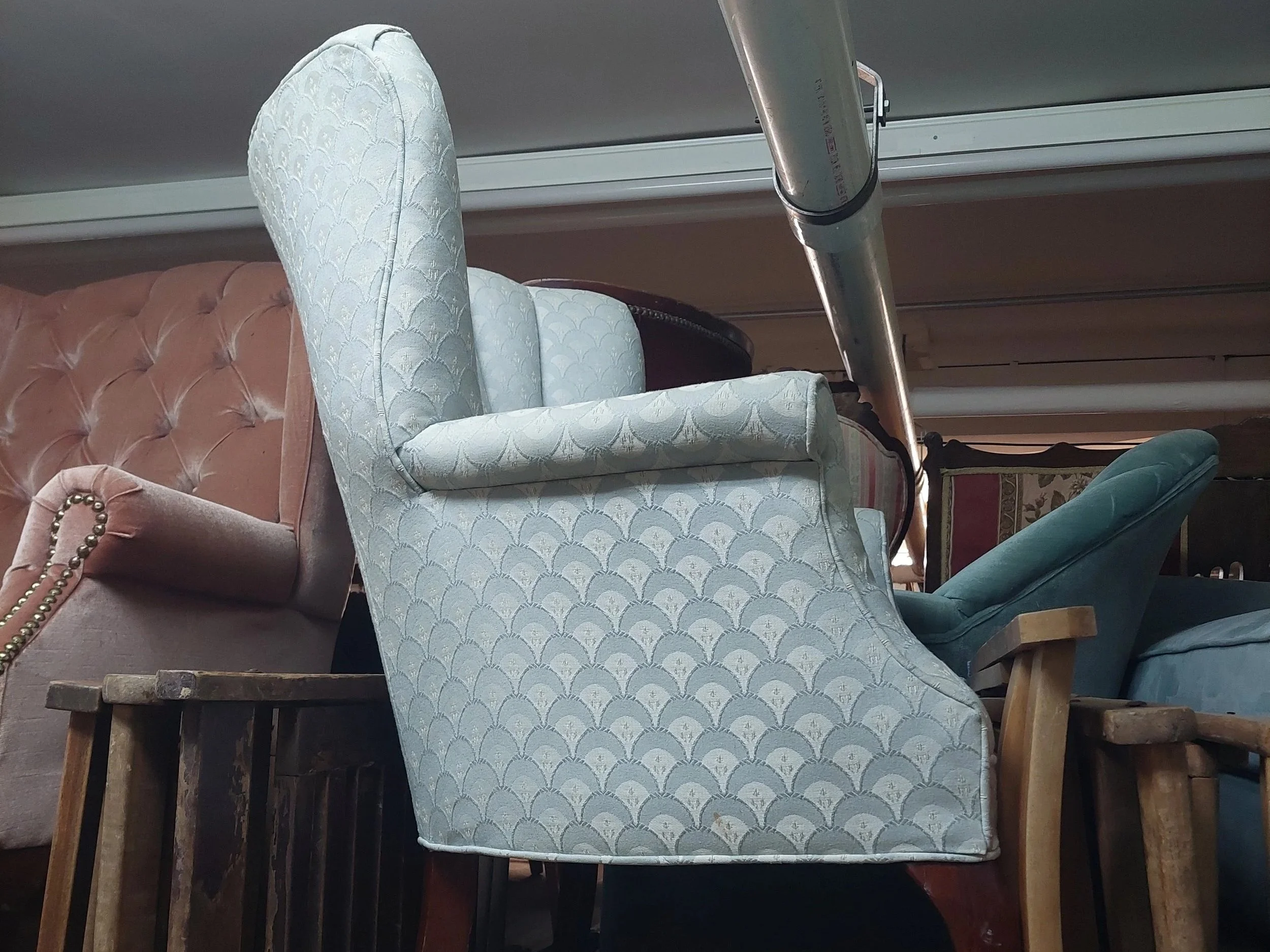 This chair for the Billiards room was the correct style, but not the right color, so we chose to cheat reupholster it.