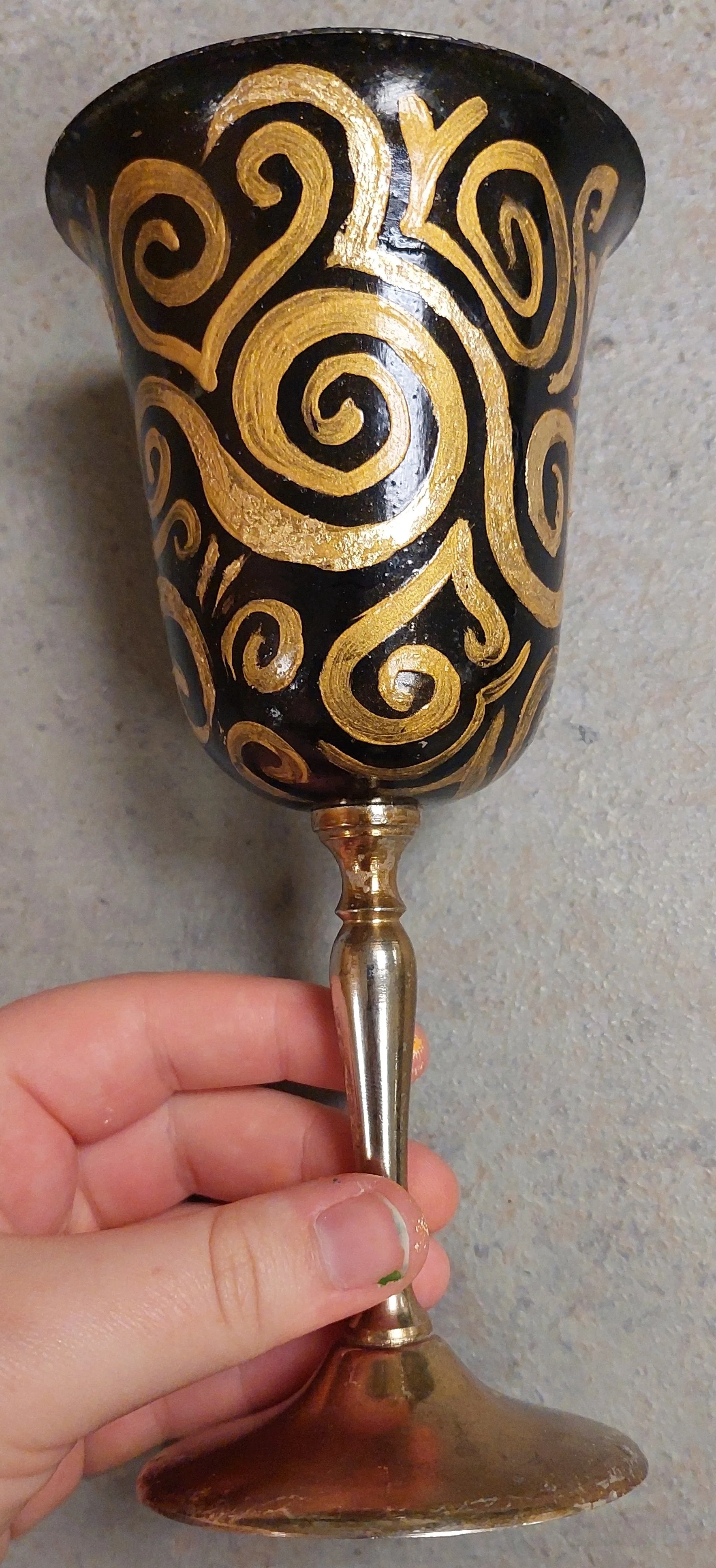 Final product, one out of eight. Designer selected the painting black then painting gold with a brush. Highlights added with gold leaf and sealed with Polycrylic. L. Miller and C. Steinmetz assisted with the spirals and sealing steps. 