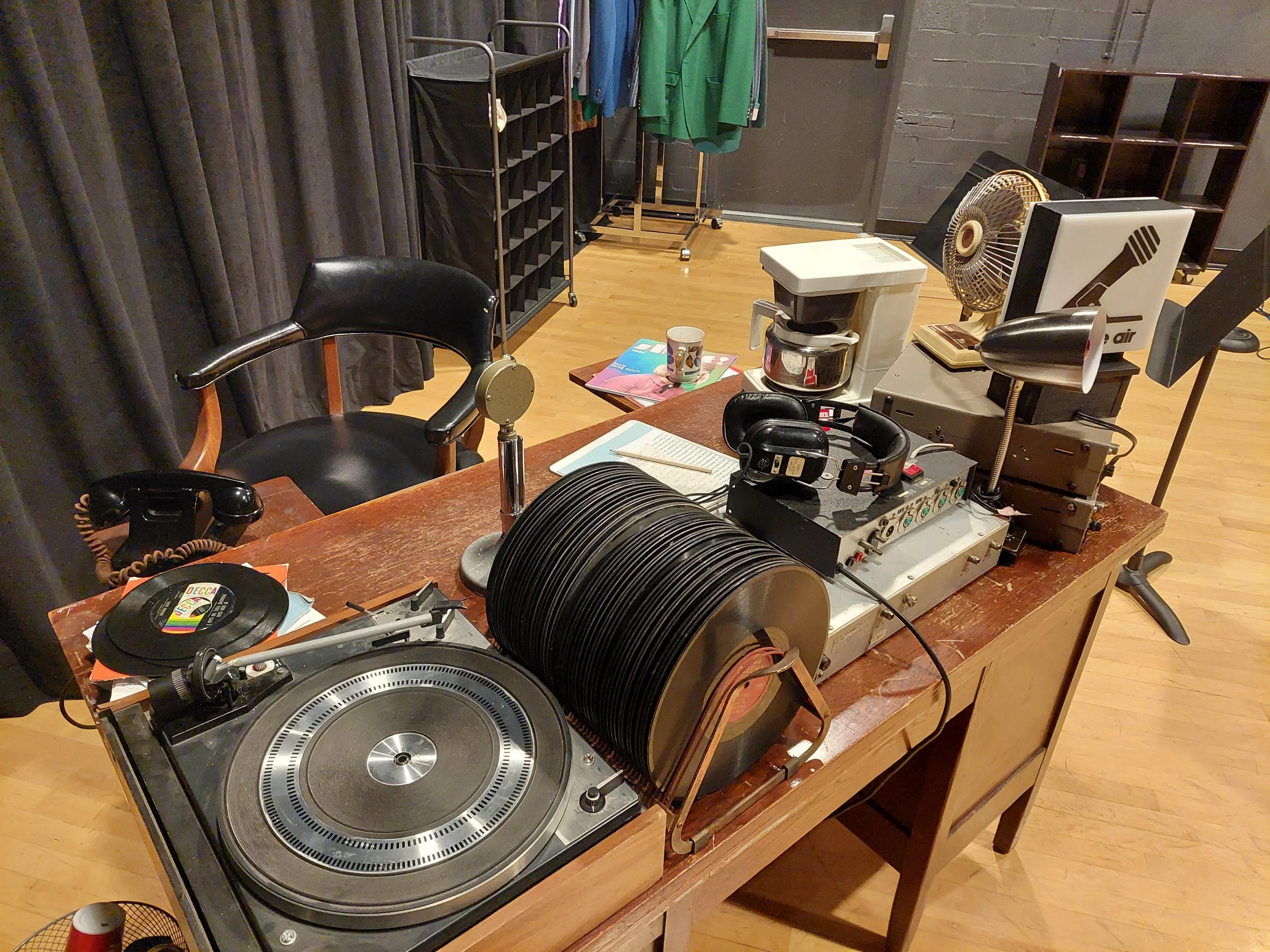Original desk, before adjustments in rehearsals. Wanted to start off with lots of toys for the actor to play with, since the script is not specific.
