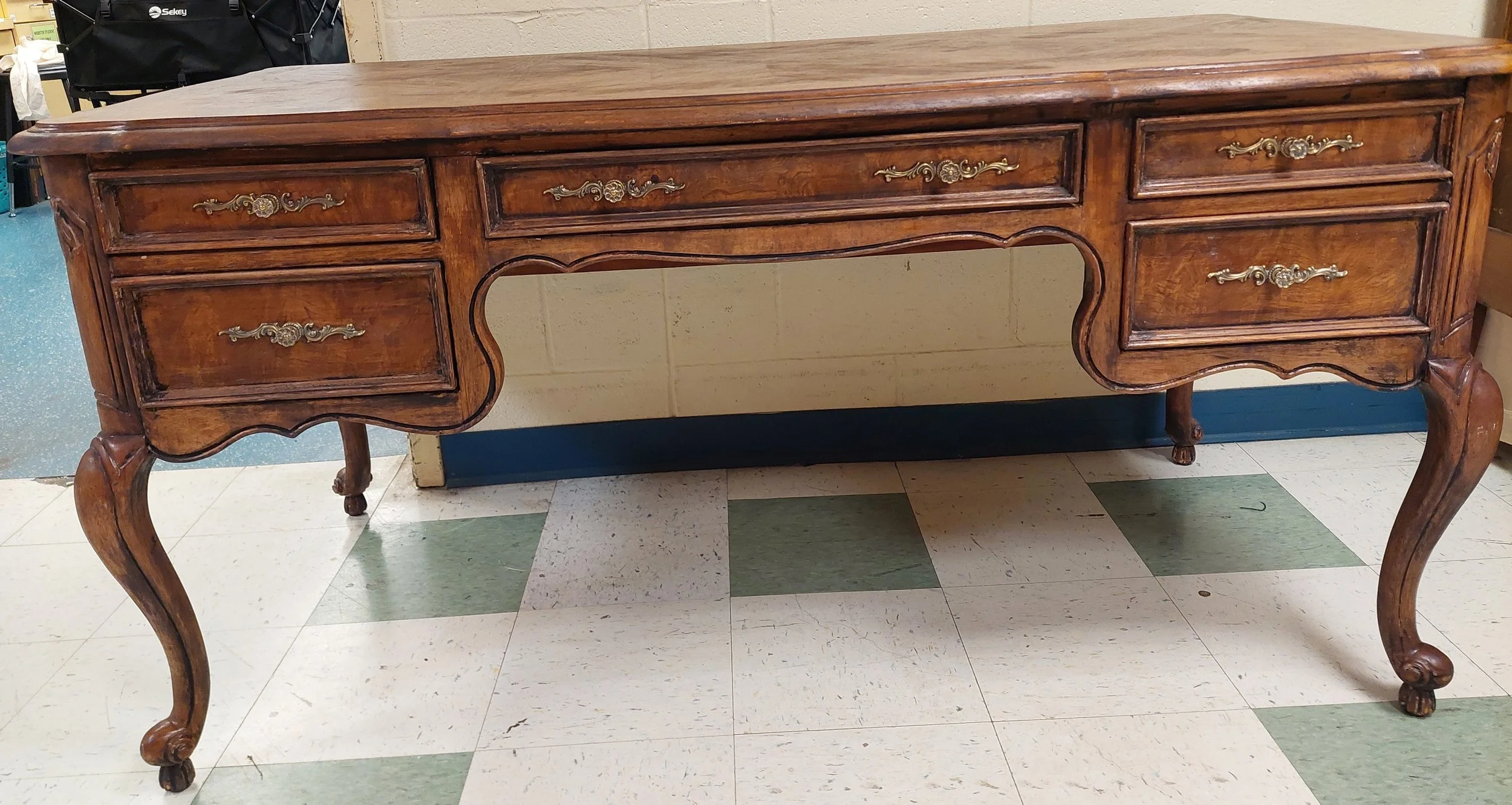 Final product backstage. Gloss/tint done by the scenic paint department. Returned the hardware, now restored to its original brassy finish. Carpentry by L. Miller removed some of the heavy underbody of the drawers, which was clearly not original to t