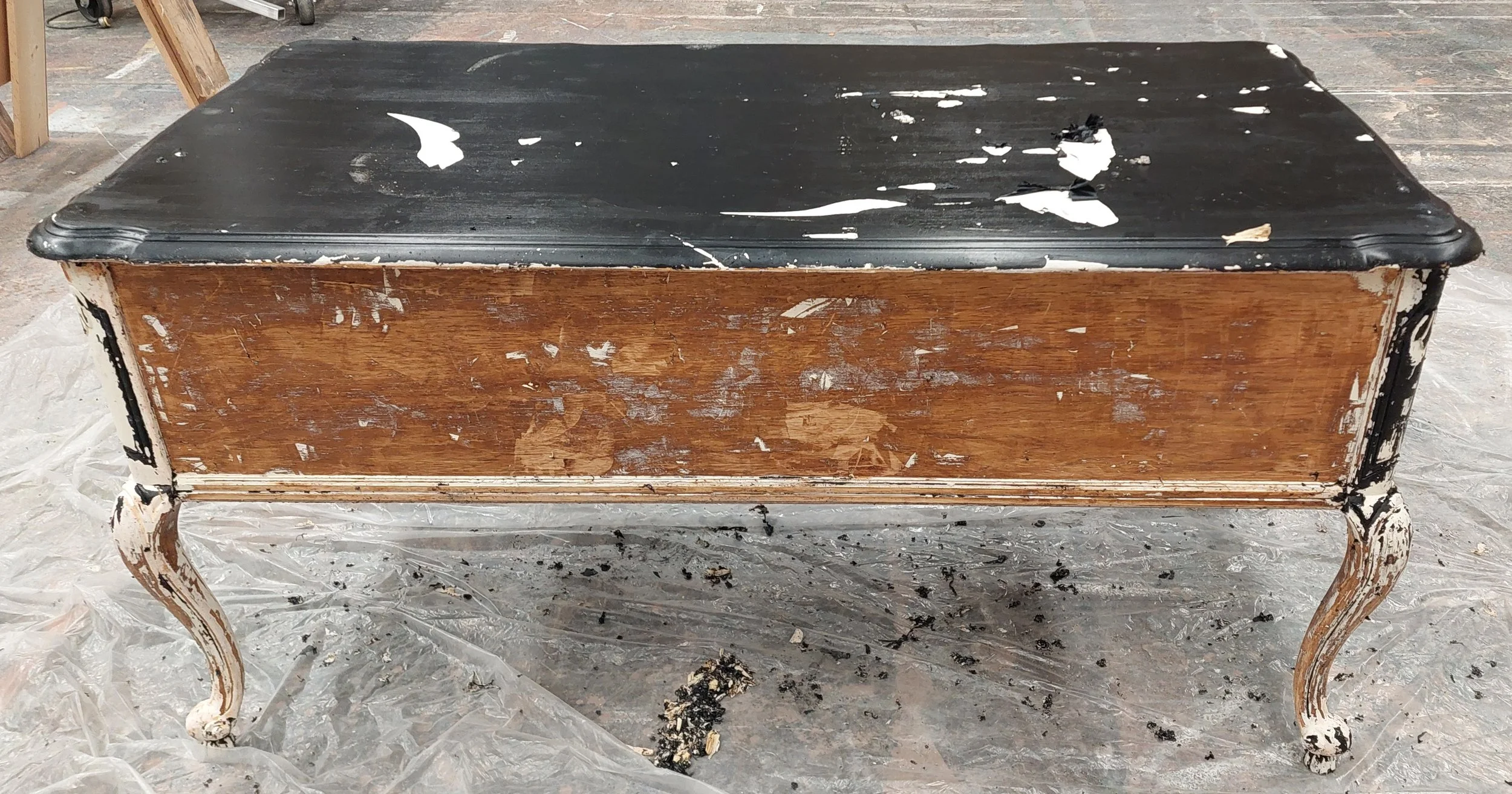 Day 3. The two paints behaved very differently throughout the process. The black layer was definitely a latex based, more glossy, house paint. We could not identify the white paint, but it was much harder to remove. The CitruStrip would only cut thro