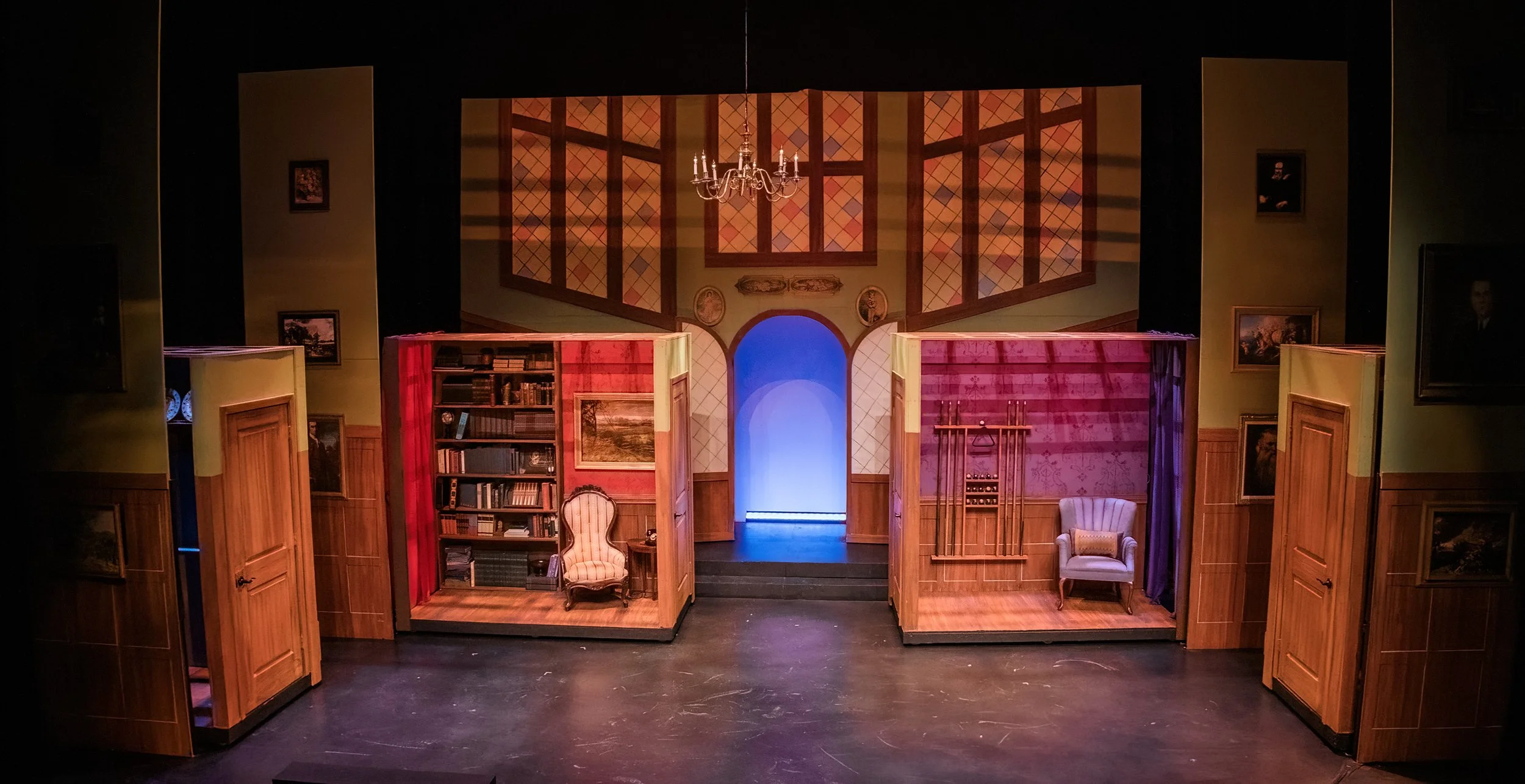 Full stage with Library and Billiards Room wagons. The library has a painting that slides to one side revealing the Evidence Panel