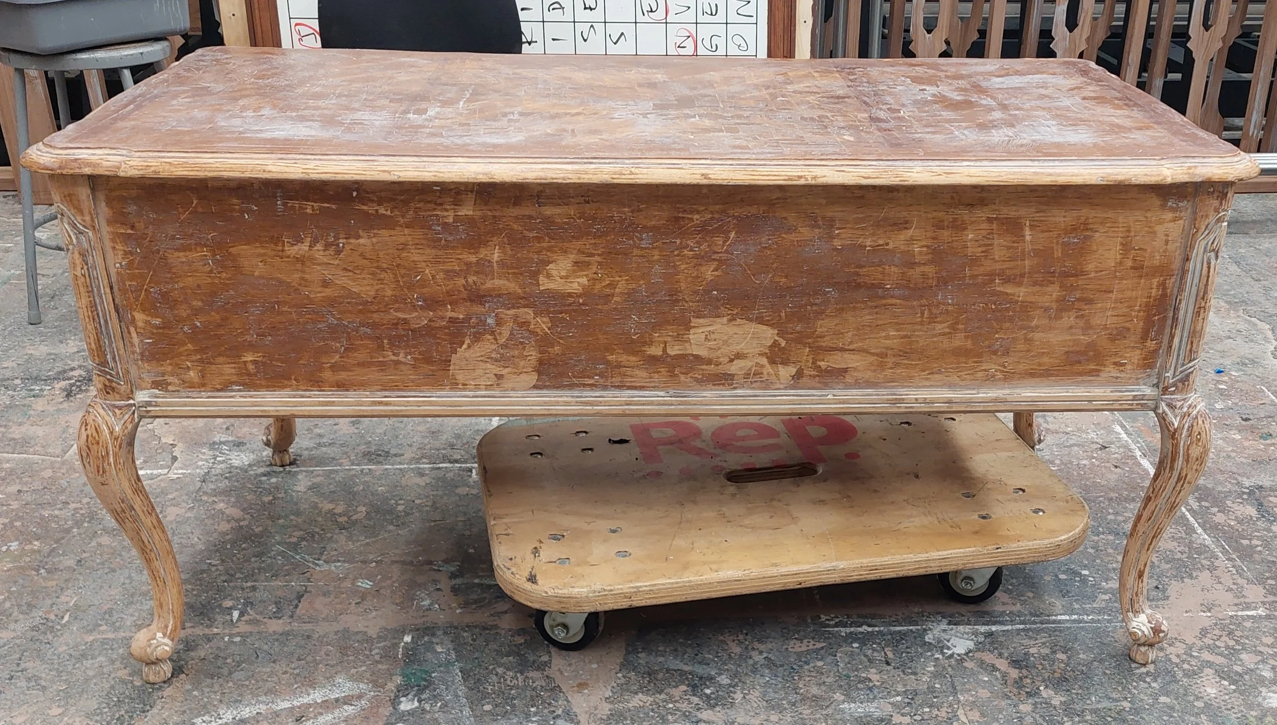 Day 5. The original varnish had been painted over without sanding, so it was coming off inconsistently in places. This was not a concern since we ended up sanding the whole thing. 