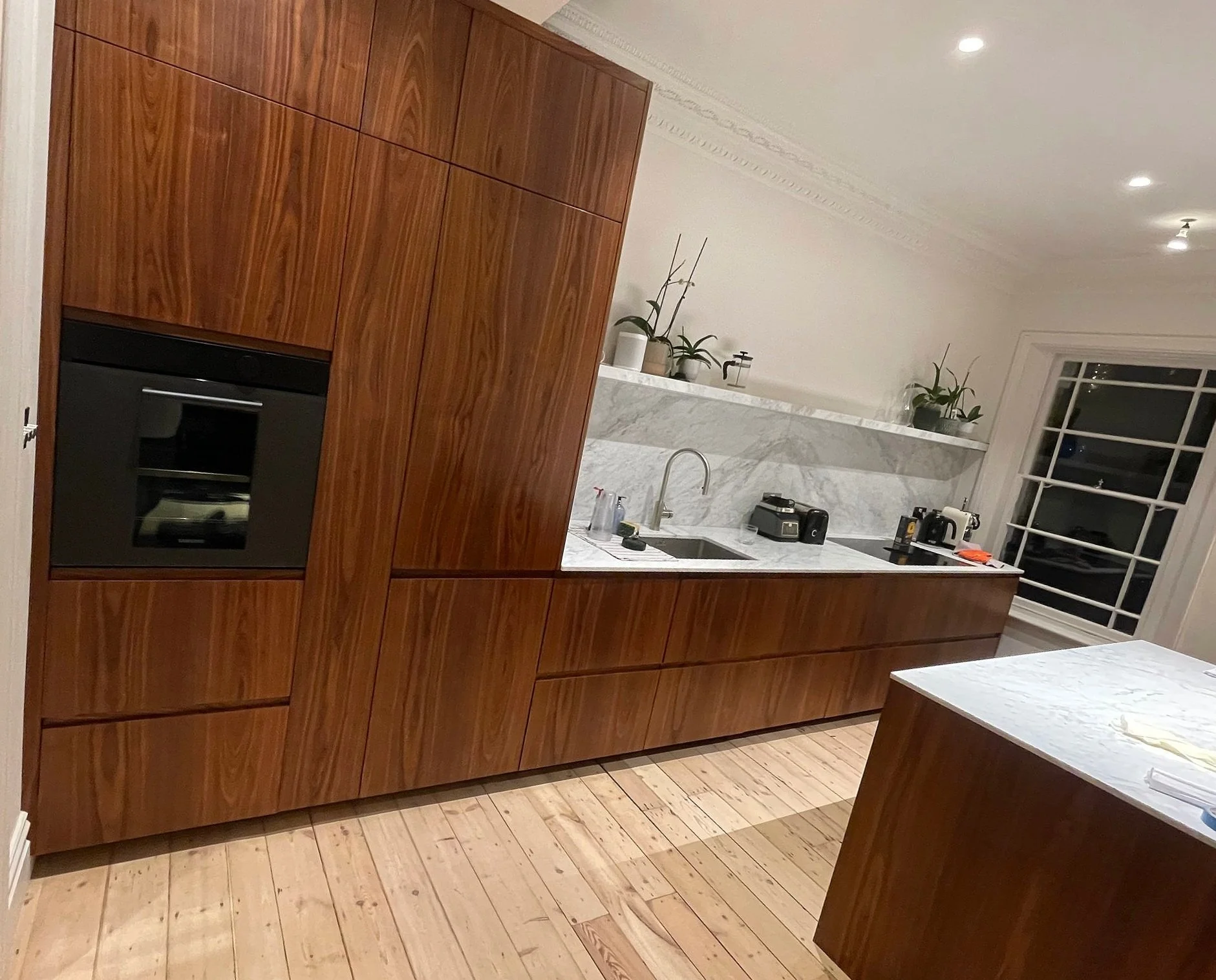 Bespoke kitchen project.Book matched veneer.