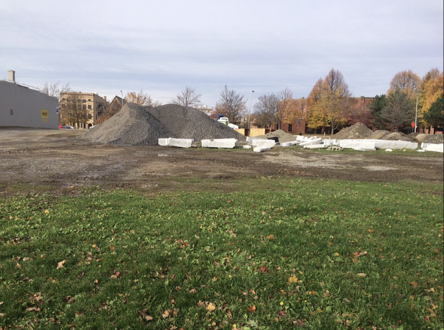   Site of the former Teck Theatre, Buffalo, New York.  The site was temporarily used to store construction materials for work on adjacent buildings, with aggregate piles and concrete barriers occupying the former location of the theater. Photograph b