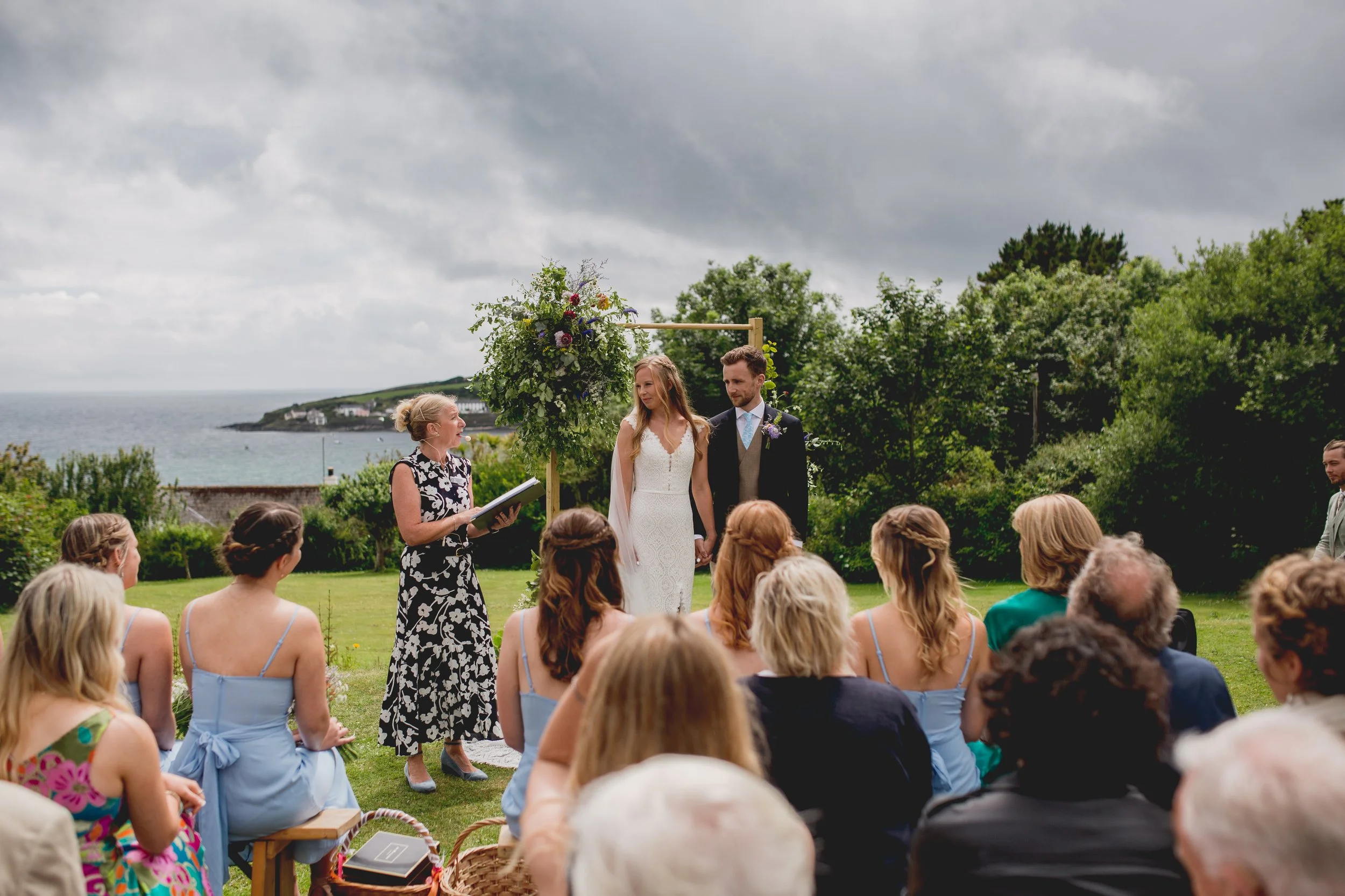 Couple with celebrant getting married