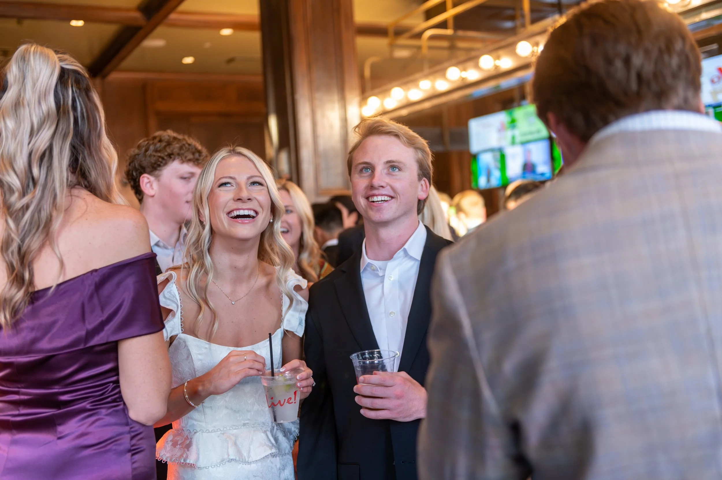Woman and man at their rehearsal dinner smiling
