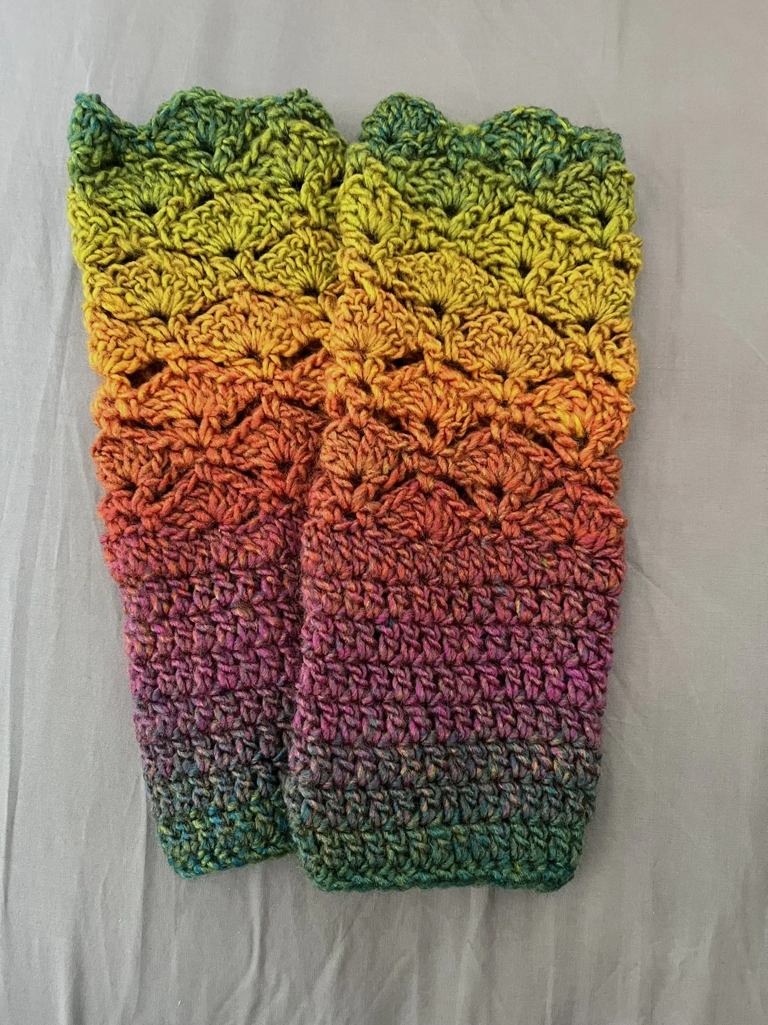 Crochet fingerless gloves in a beautiful autumn colours - green, yellow orange and purple. Made with acrylic yarn in a subtle colour transition