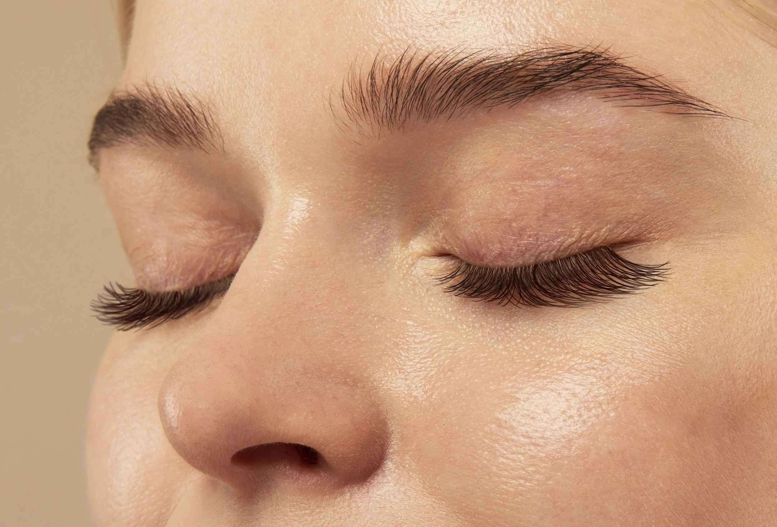 closeup image of a woman's eyebrows and eyelashes; lash lift and tint smithtown