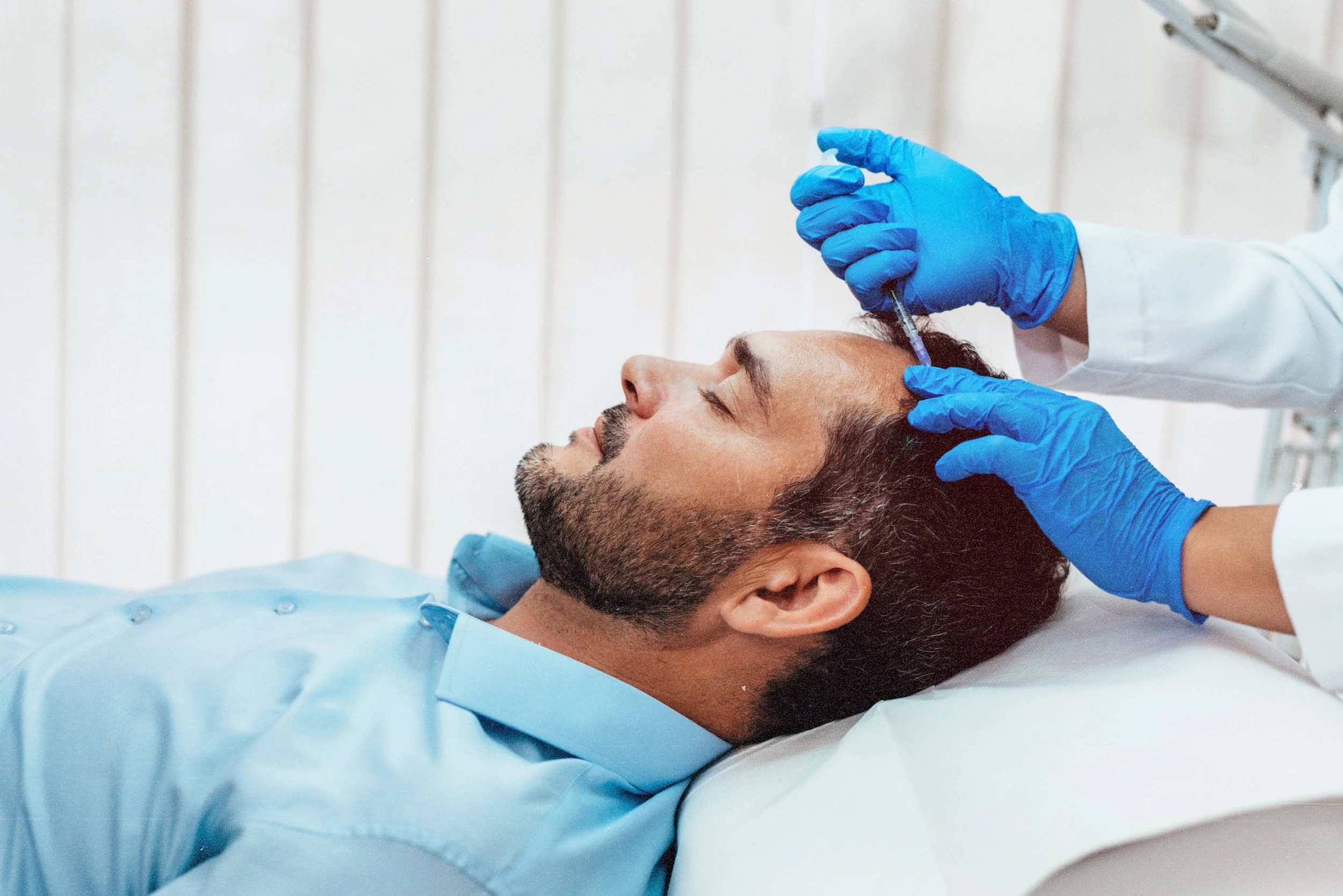 Patient receiving mesotherapy for hair regrowth at Birmingham clinic.