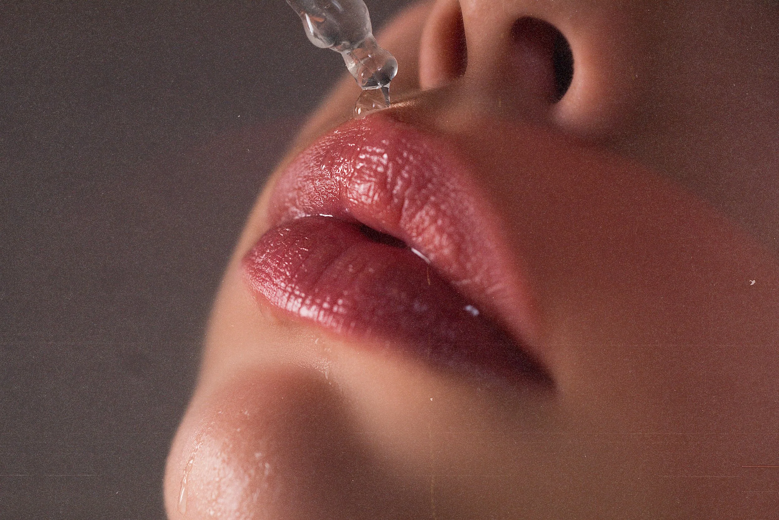 Patient receiving lip hydration with fillers for smooth lips in Birmingham.