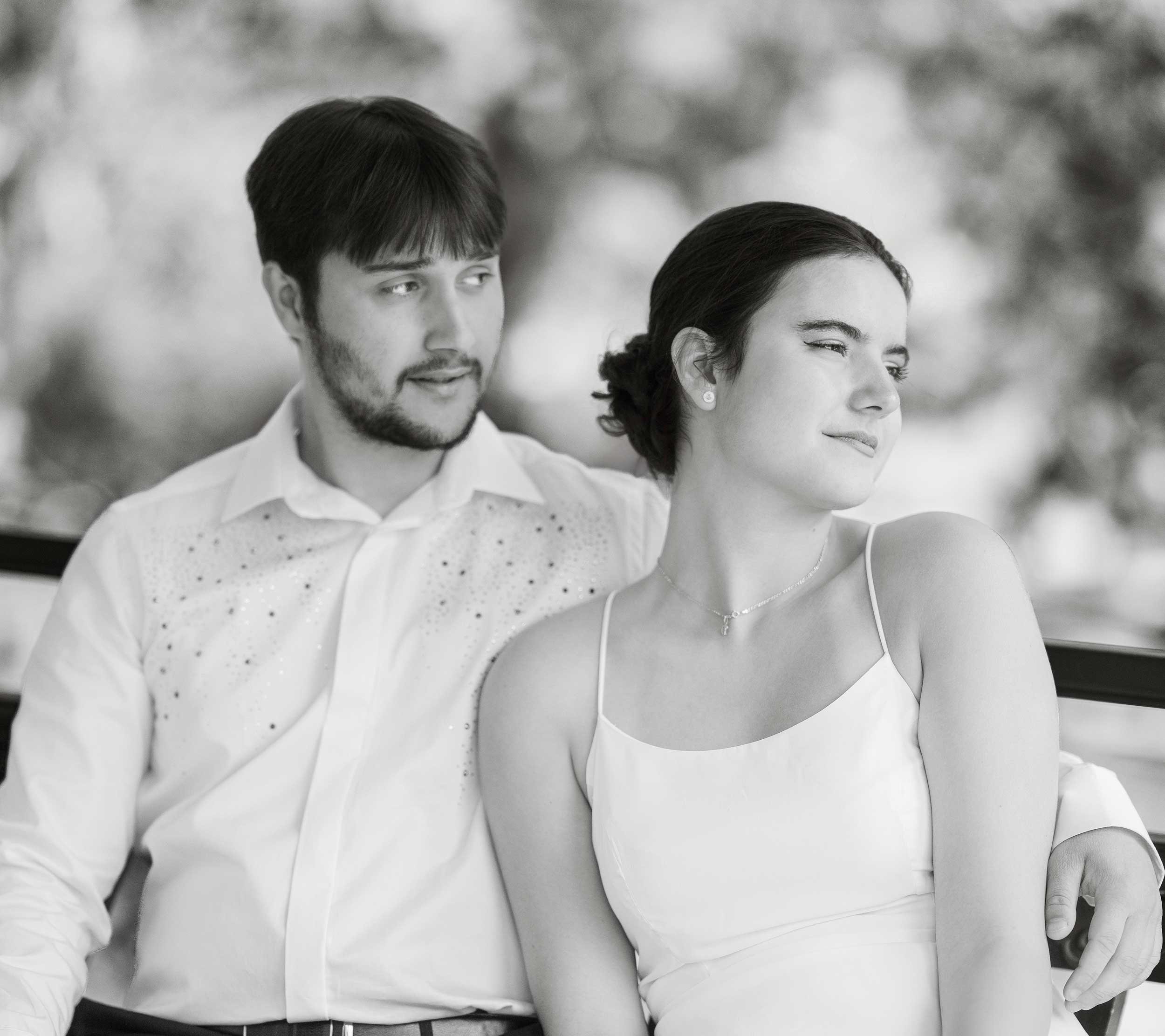 A timeless black-and-white engagement portrait capturing the couple’s natural elegance and serene connection. The artistic tones and soft focus create a classic and romantic atmosphere.

