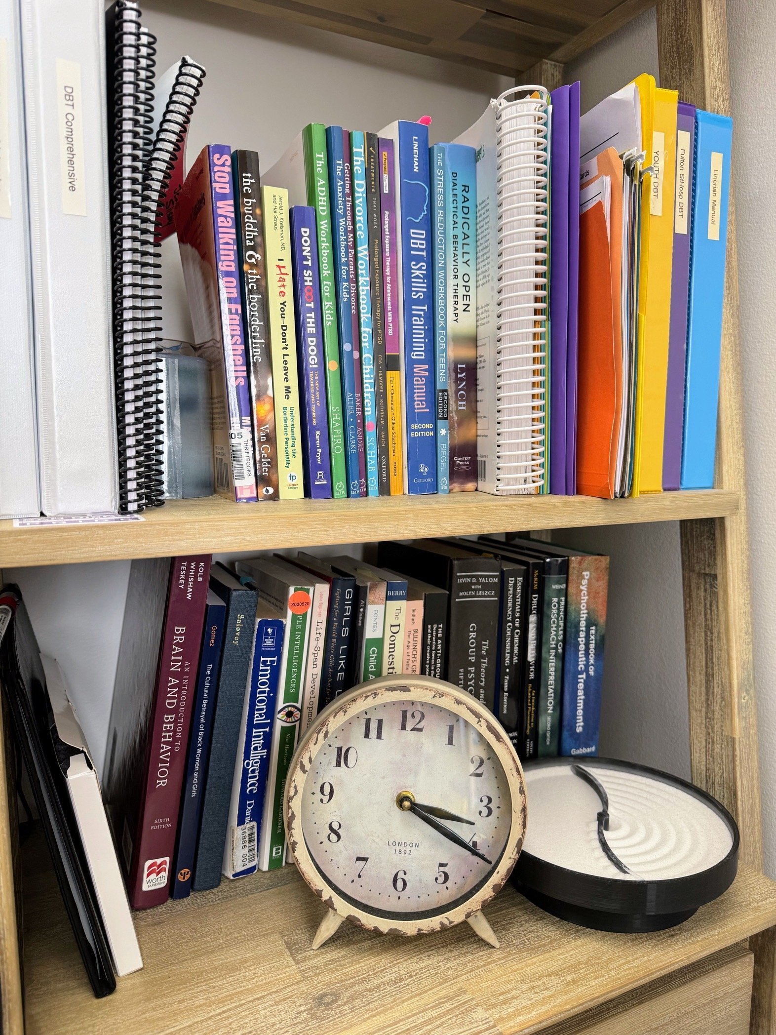 Bookshelf at in-person therapy office in San Diego, CA