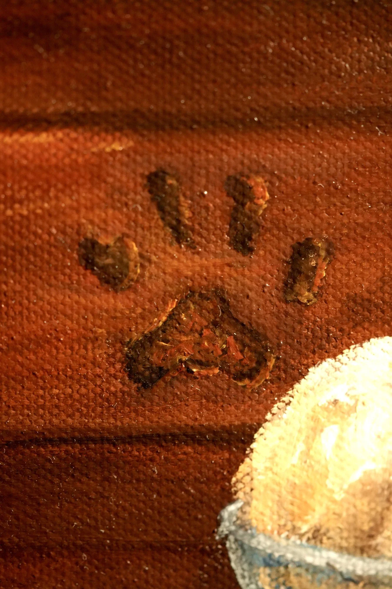 Detail of a painted paw print texture on a wooden drawer in an oil painting still life