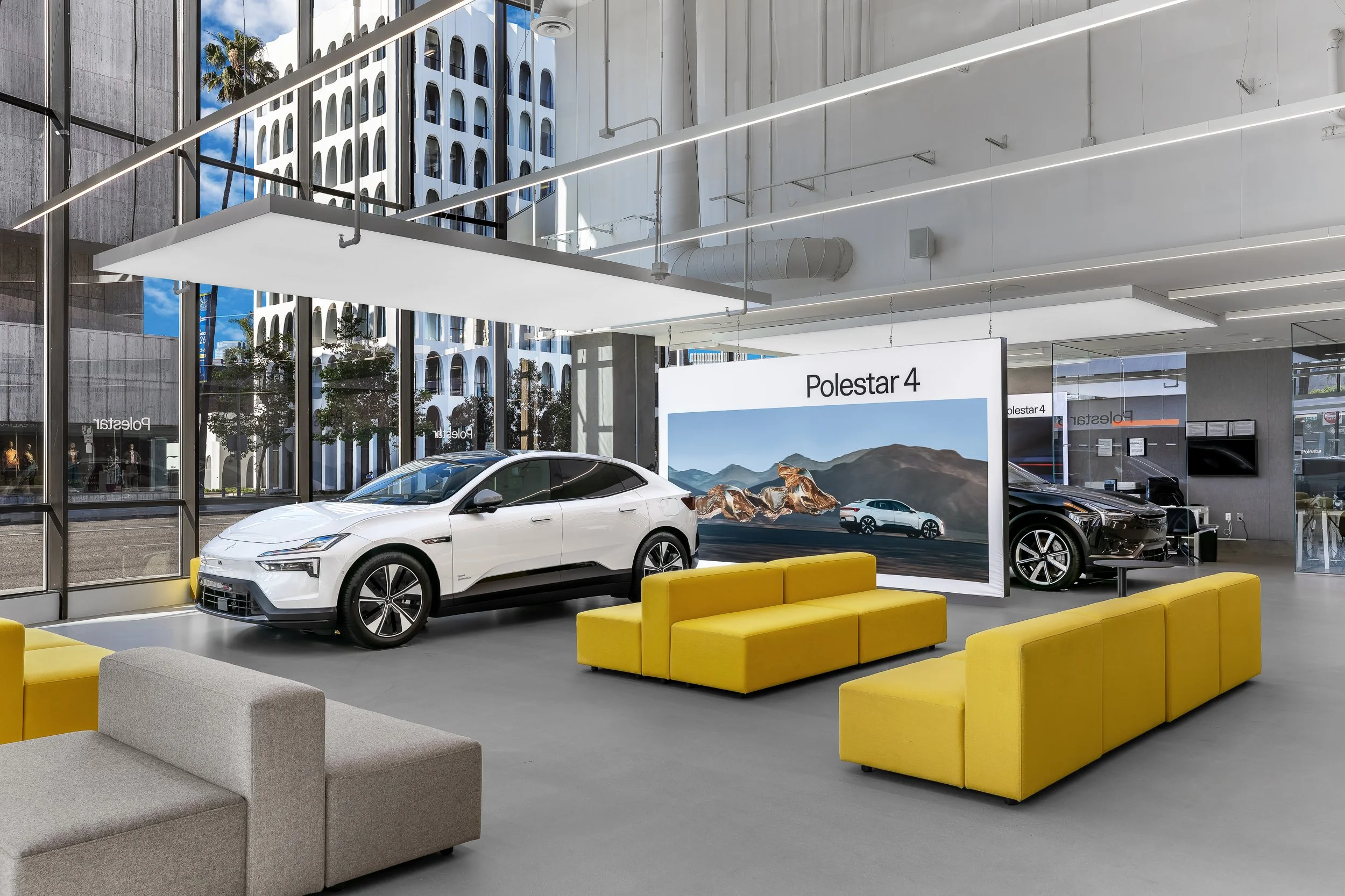  Interior architectural photograph of the Polestar Beverly Hills showroom highlighting modern retail design, expansive glazing, and contemporary automotive display space. 
