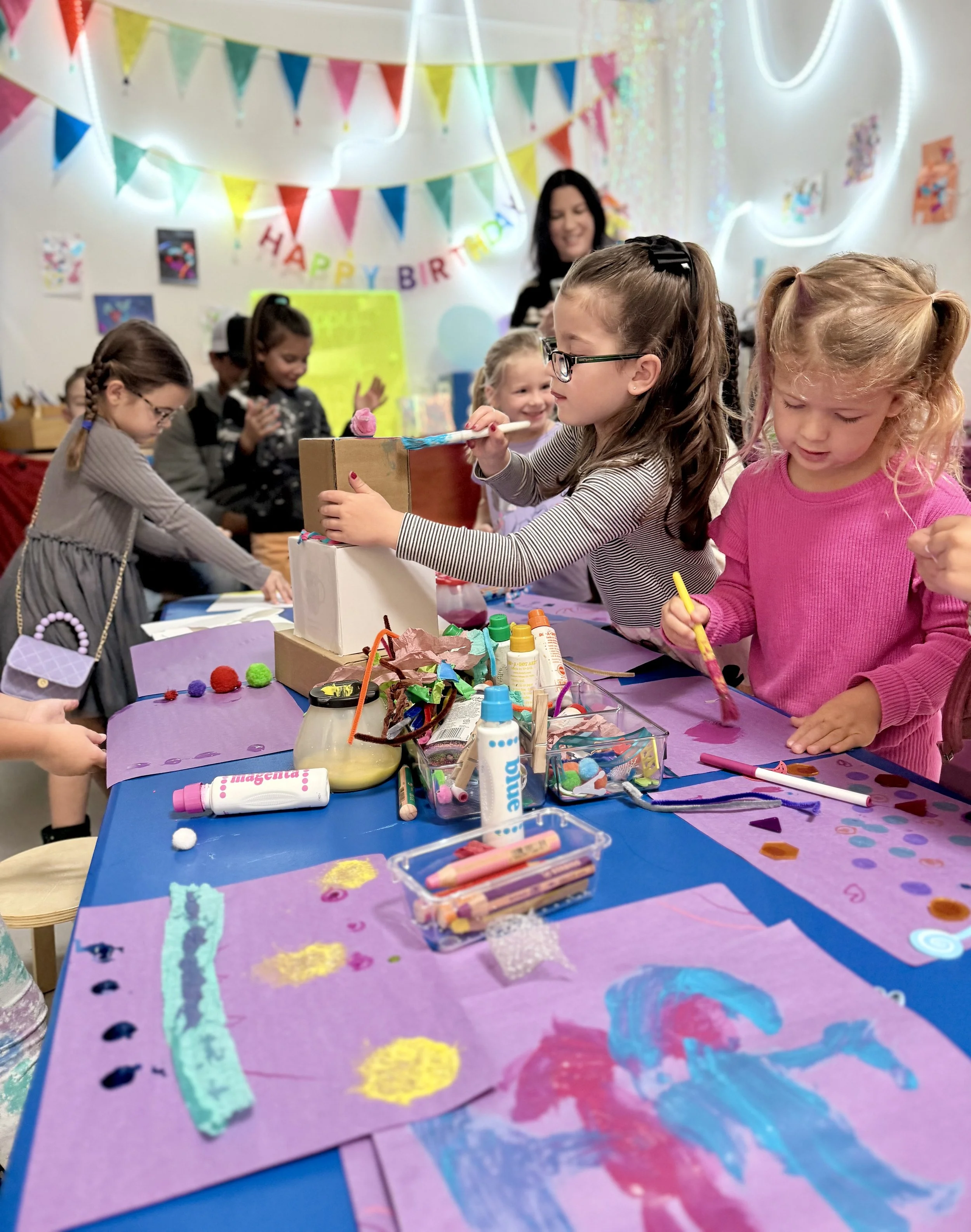 Kids doing a guided art activity during a birthday party