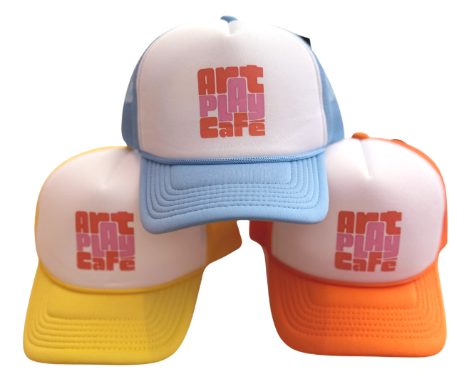 Art Play Café branded hats available in-store.