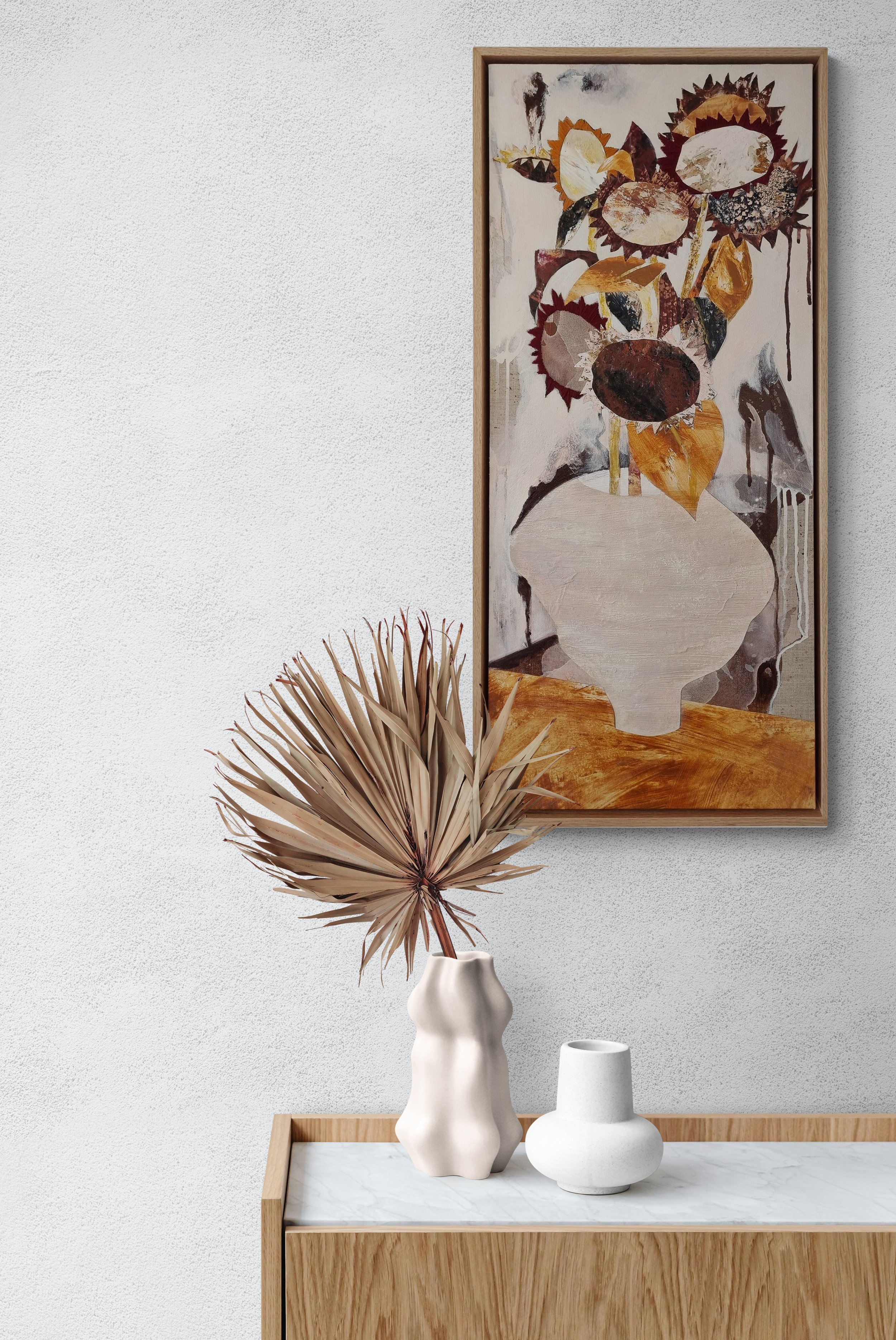 palm-frond-and-vases-sitting-on-a-table.jpg