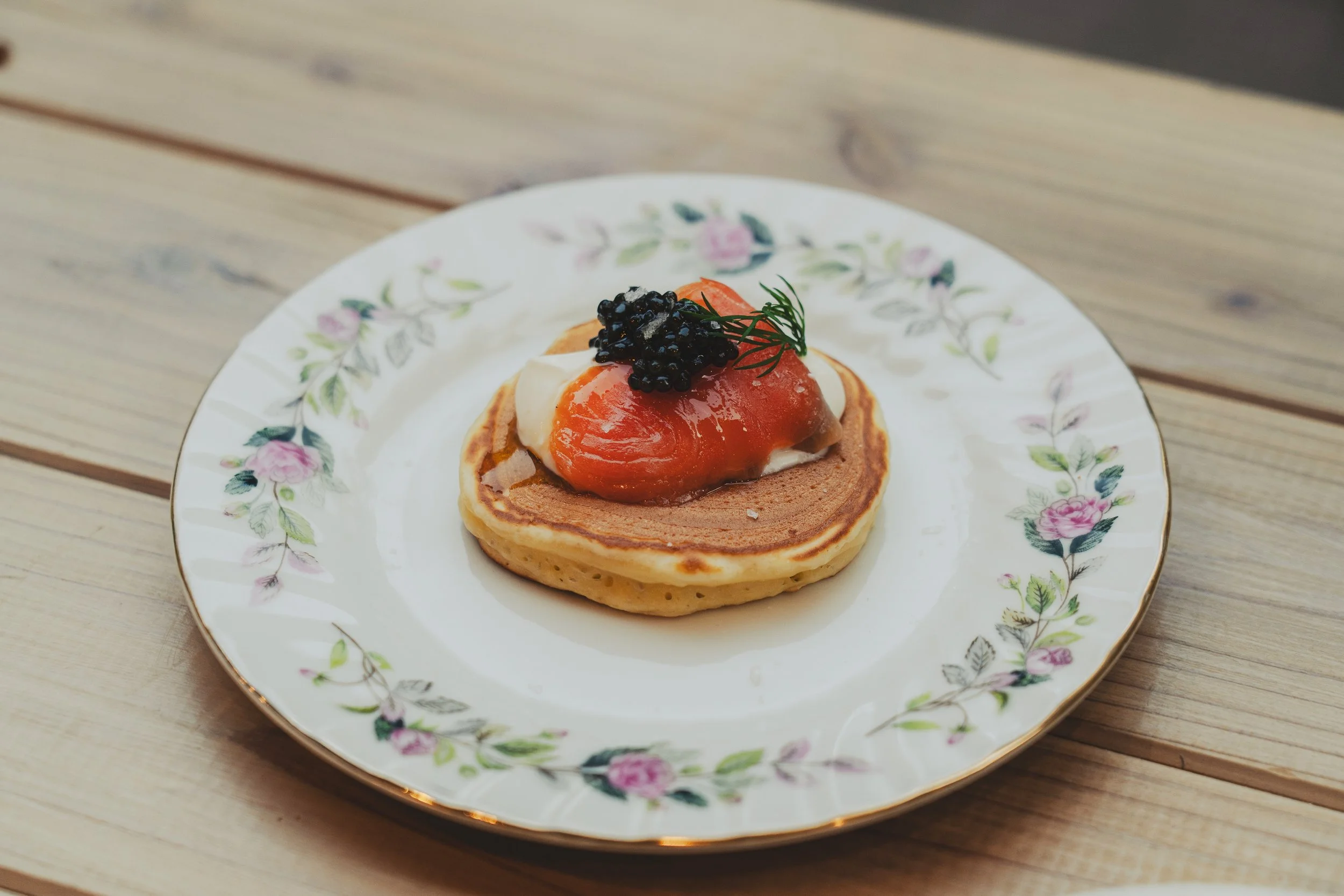caviar, smoked salmon, crème fraîche, mini pancake