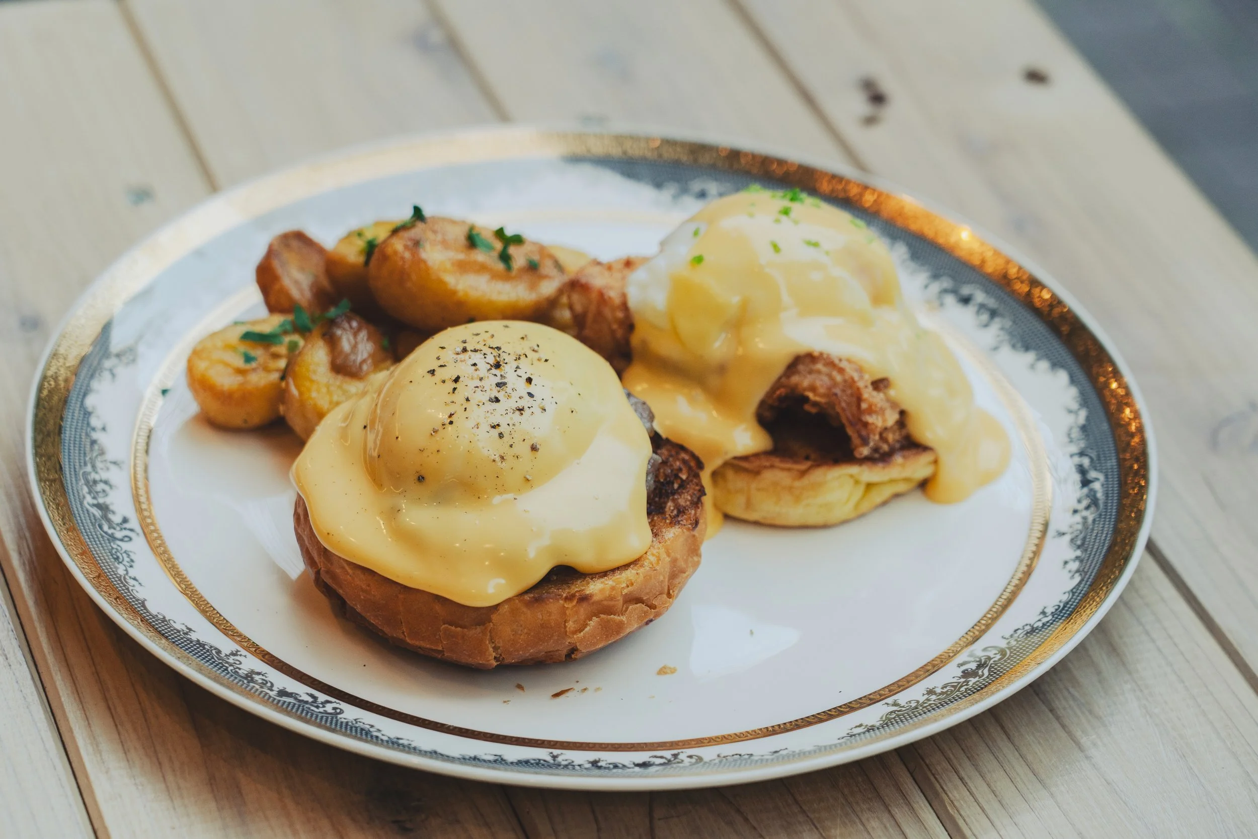 P.F.C & Kinka pork sausage, poached egg, hollandaise, brioche bun