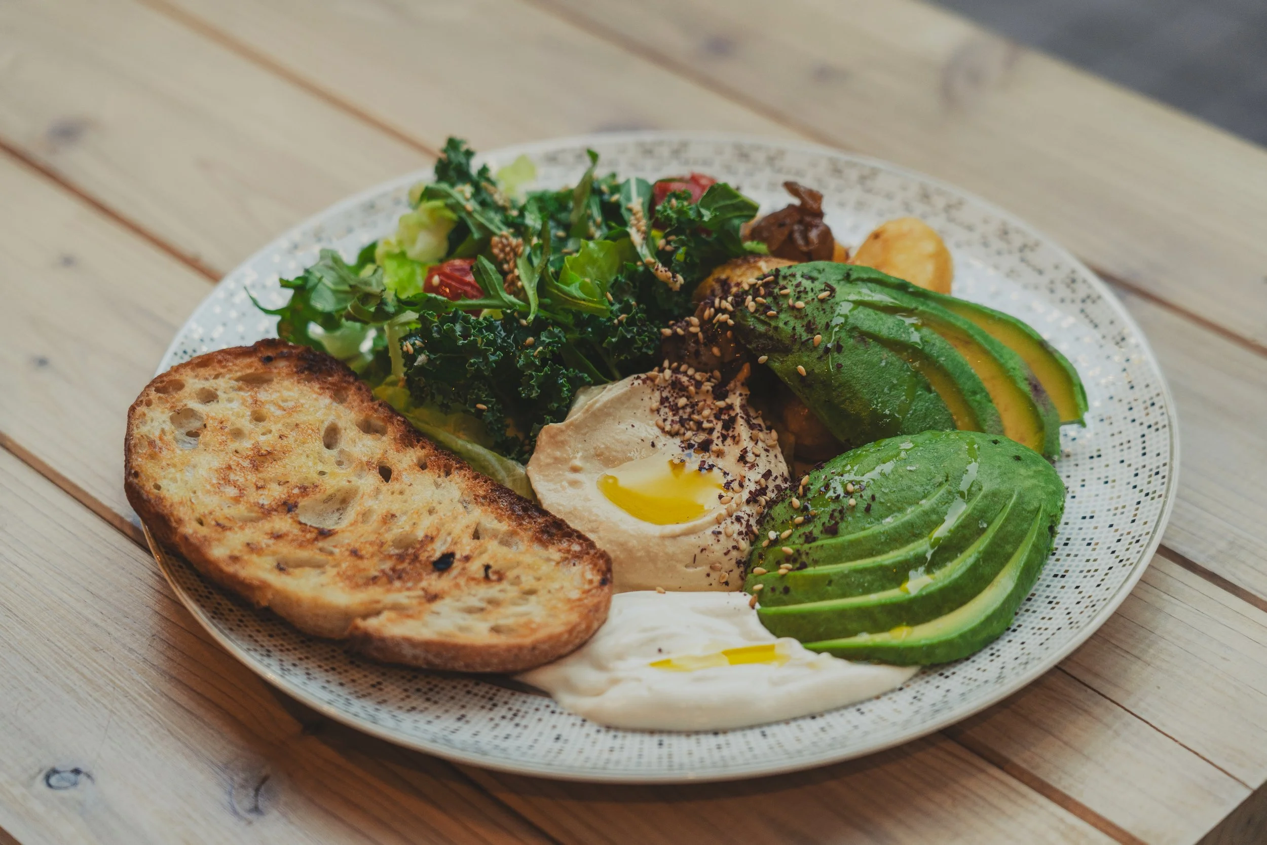 hummus, avocado, potatoes, mushrooms, soy garlic cream, green salad