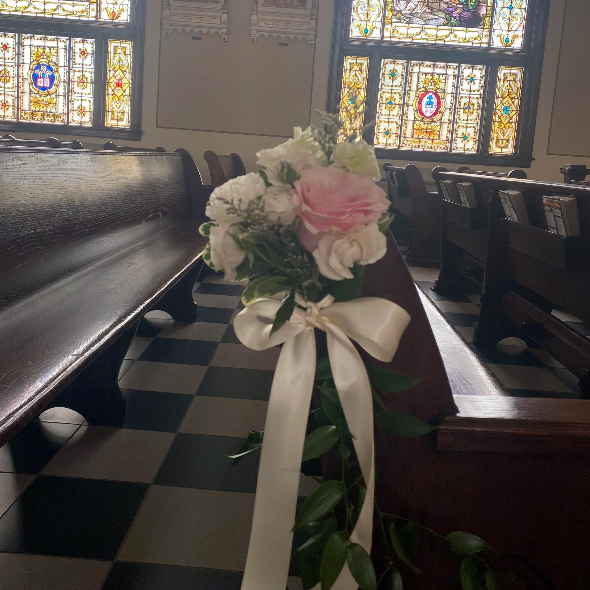 pew marker tied with ribbon