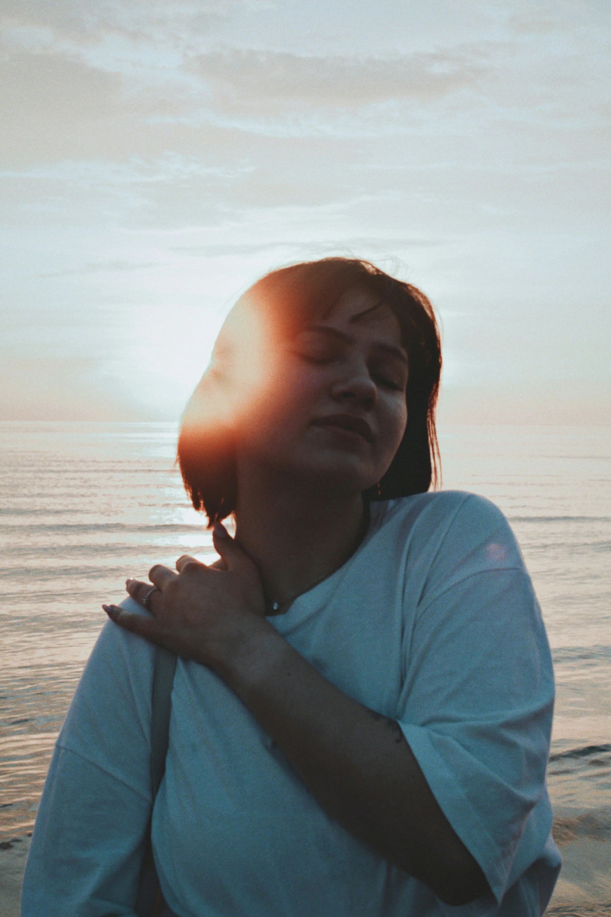 A person in somatic experiencing therapy in Chicago, smiling after somatic therapy with Helen Wyatt
