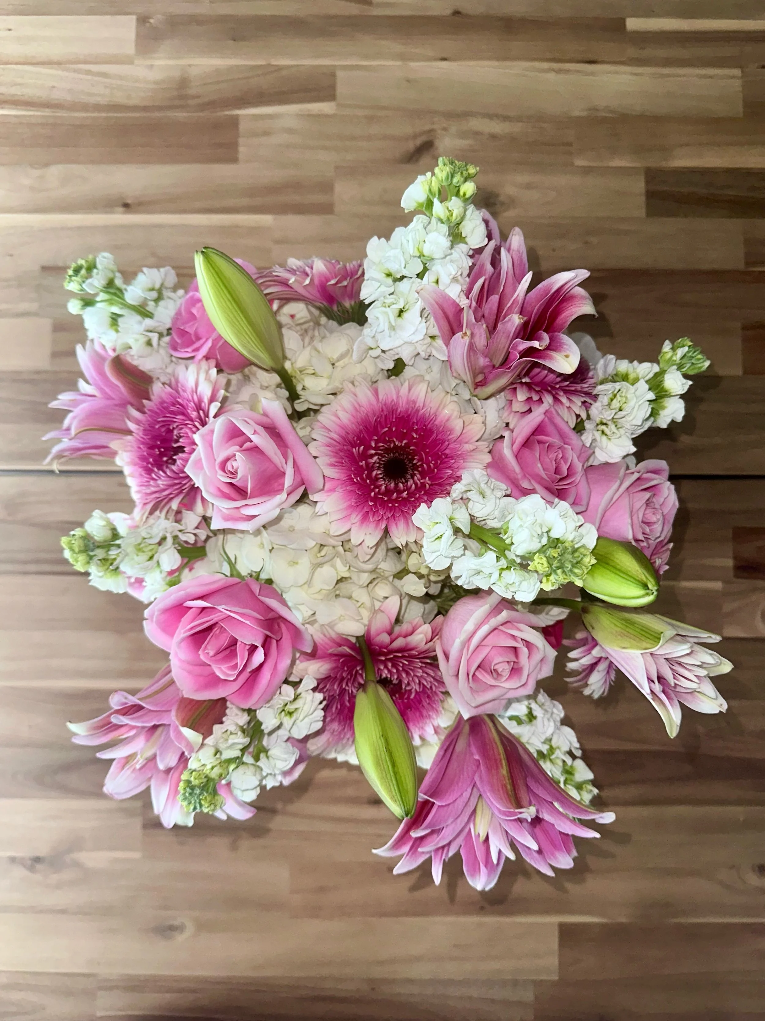 A soft palette with a strong presence.

Blush blooms, layered texture, and timeless elegance come together in this custom design, created to celebrate a special anniversary and a beautiful chapter worth honoring.