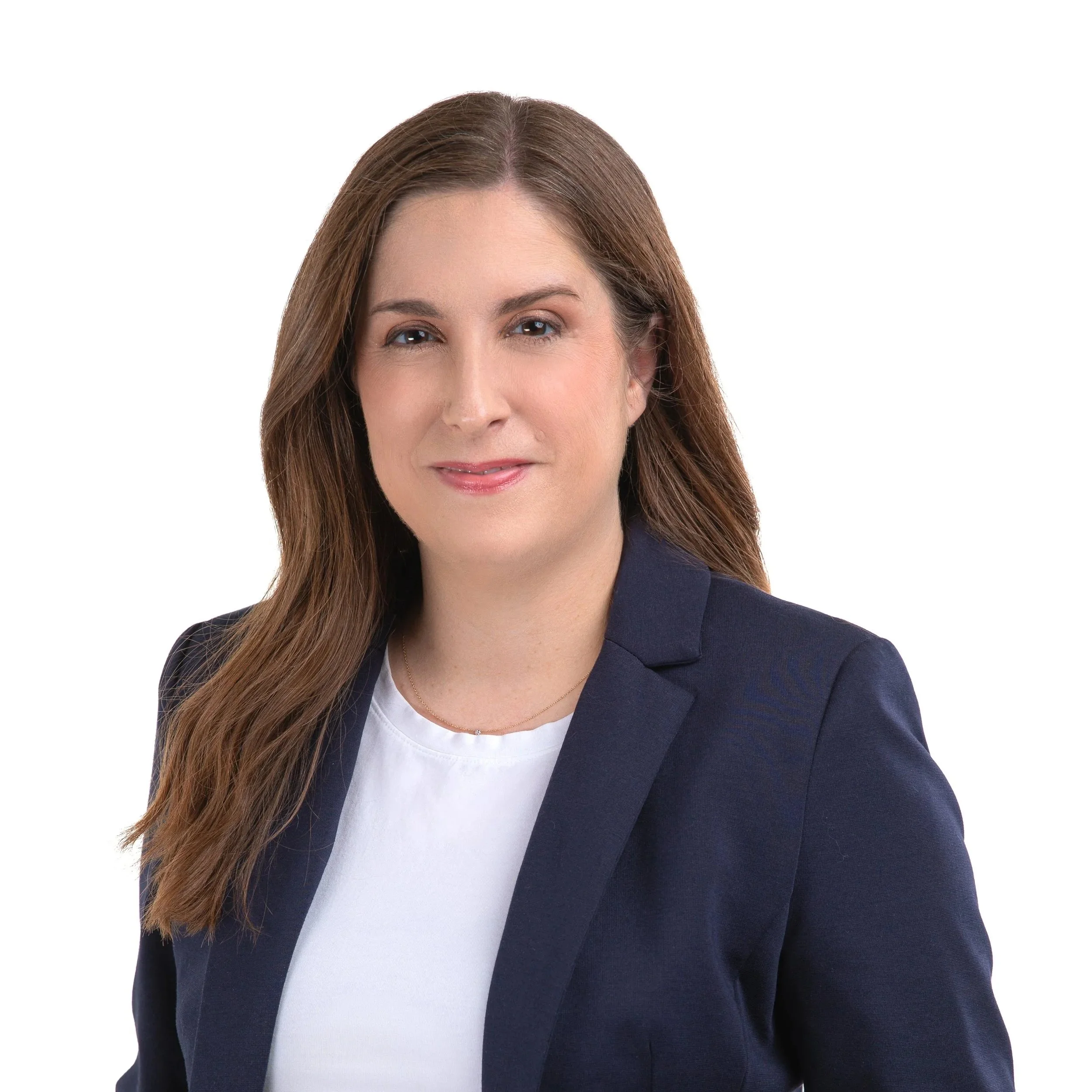 Professional woman with brown hair in a dark blazer and white top, posing against a white background.