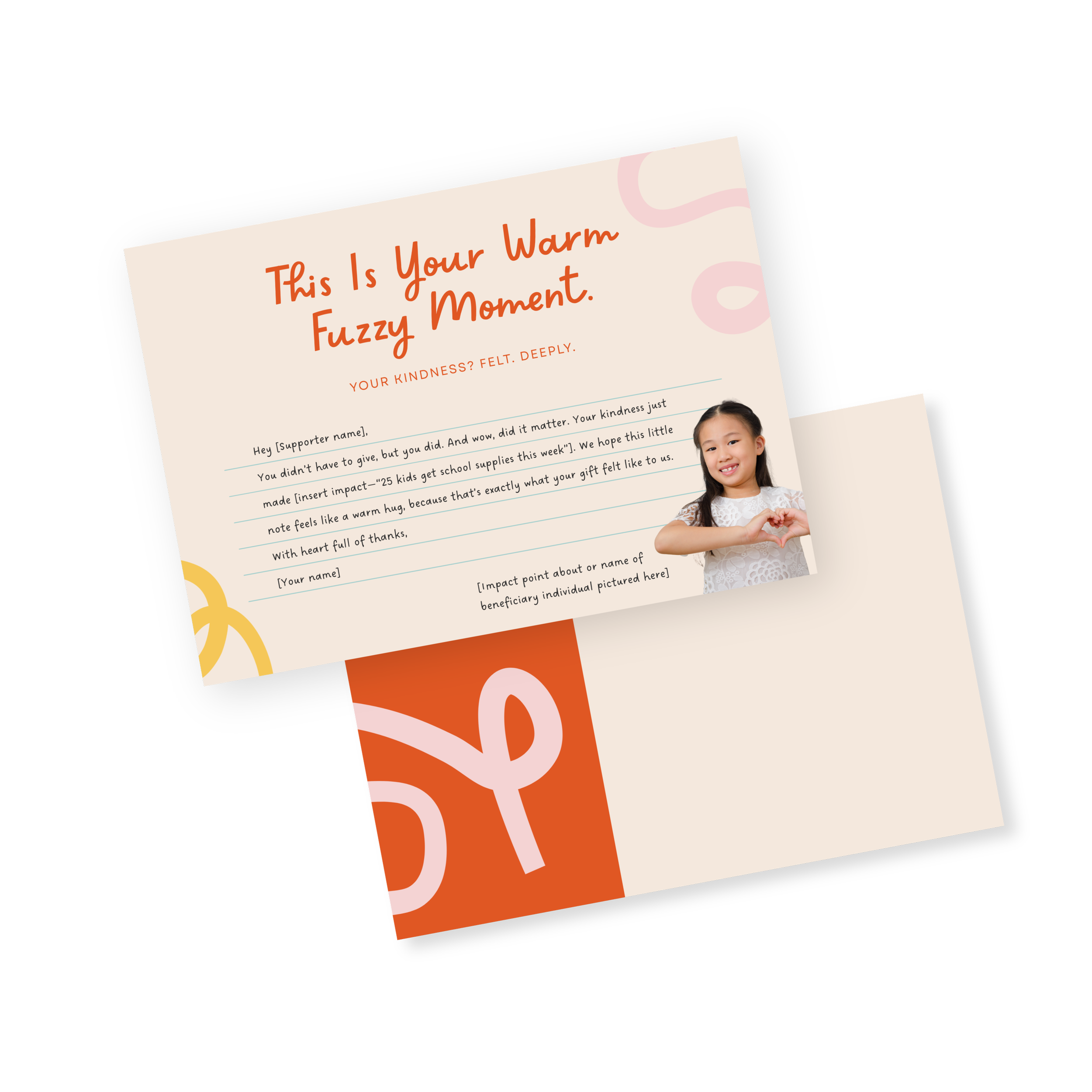 A thank you card with a photo of a young girl making a heart shape with her hands. The card has orange and pink accents and a message expressing gratitude for a donation of school supplies.