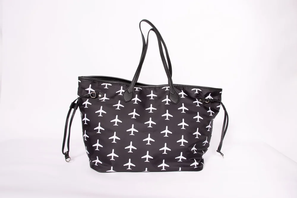Black and white airplane-print Cranky Crewmember bag