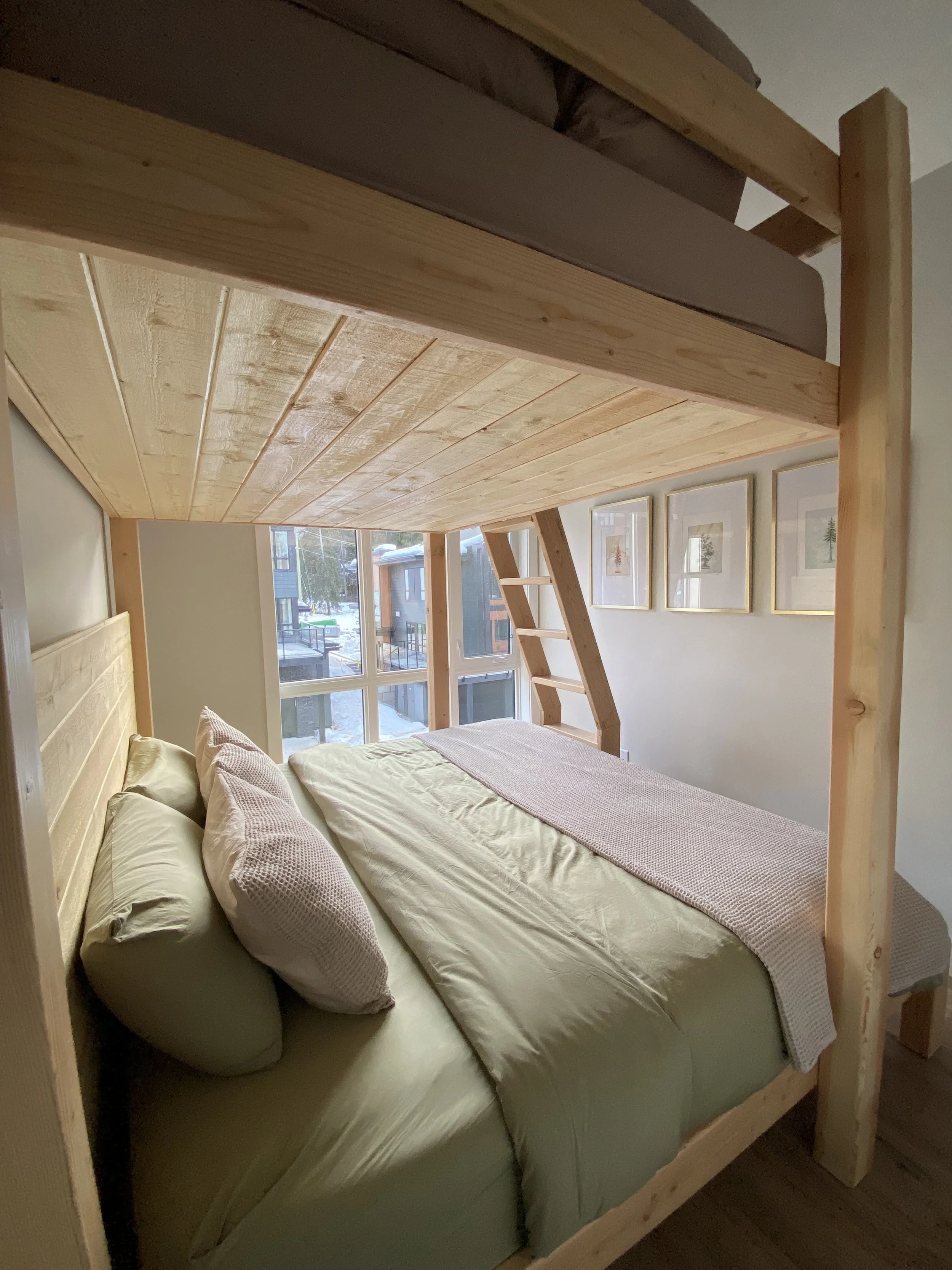 Cariboo room boasts a custom fir queen-over-king bunk bed, silk & snow bedding & blackout curtains. Though floor space is limited there is thoughtful clothing storage in the closet as well as plenty of wall hooks.