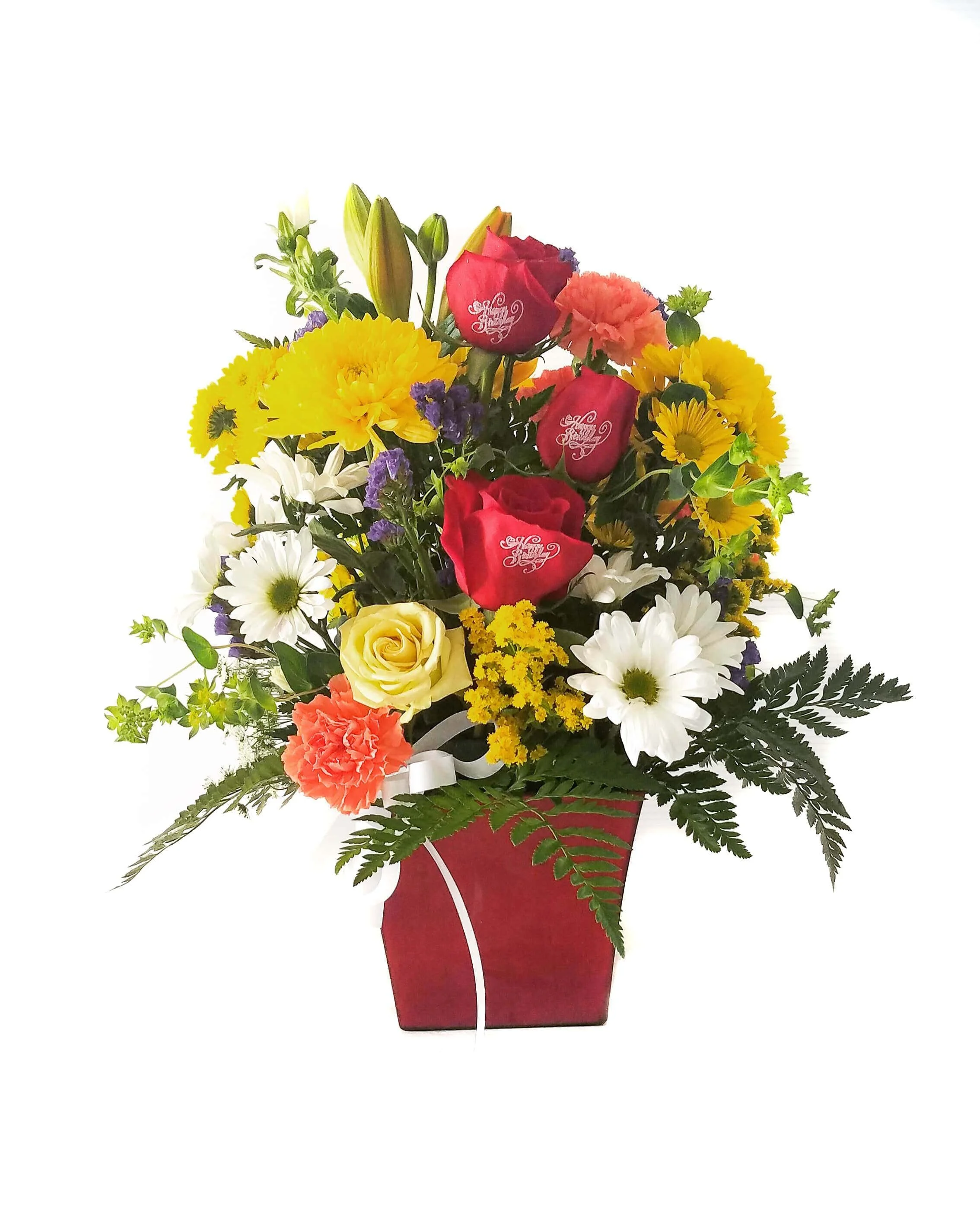 Red roses and yellow flowers in a red container