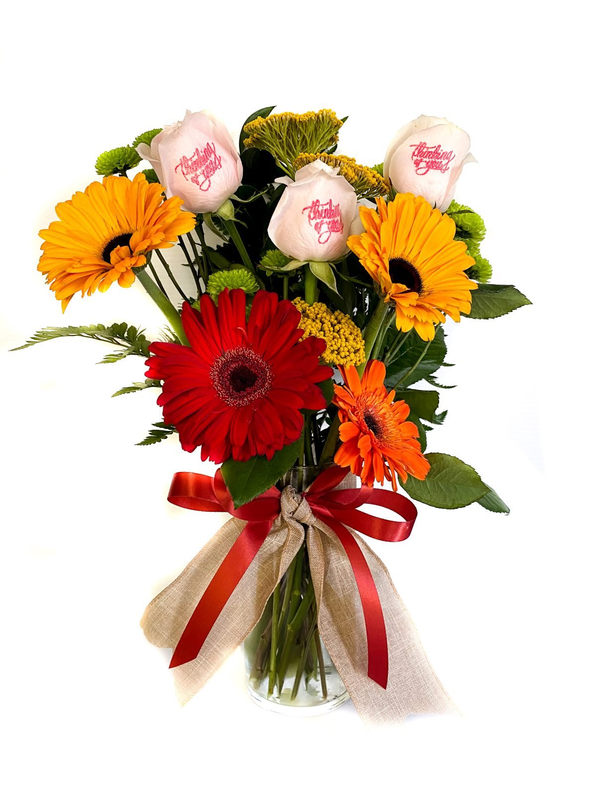 Gerbera daisies & pink roses in a vase