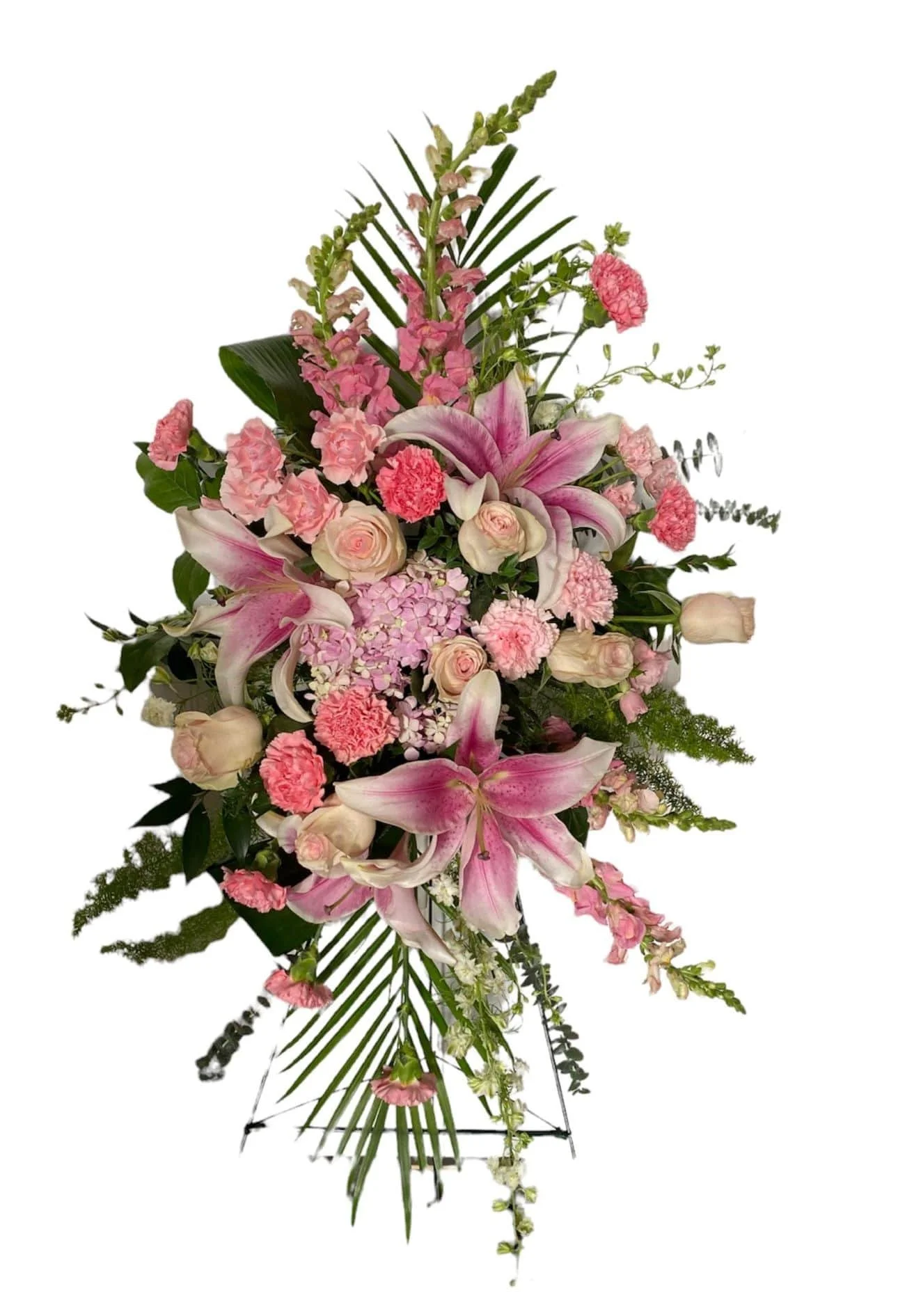 Light pink lilies, roses & snaps in a funeral easel spray