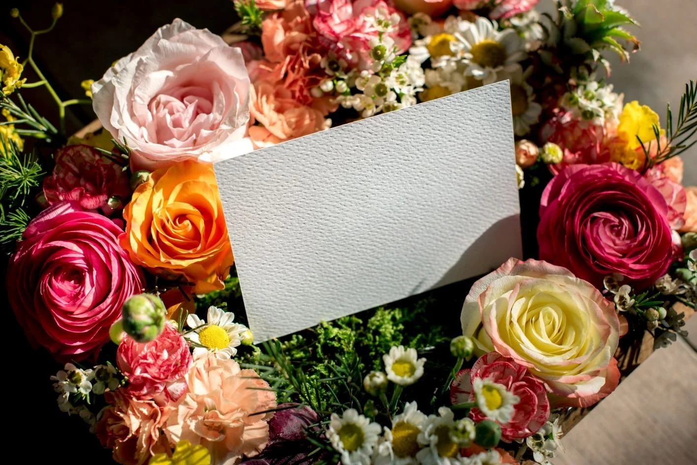 Greeting card surrounded by flowers