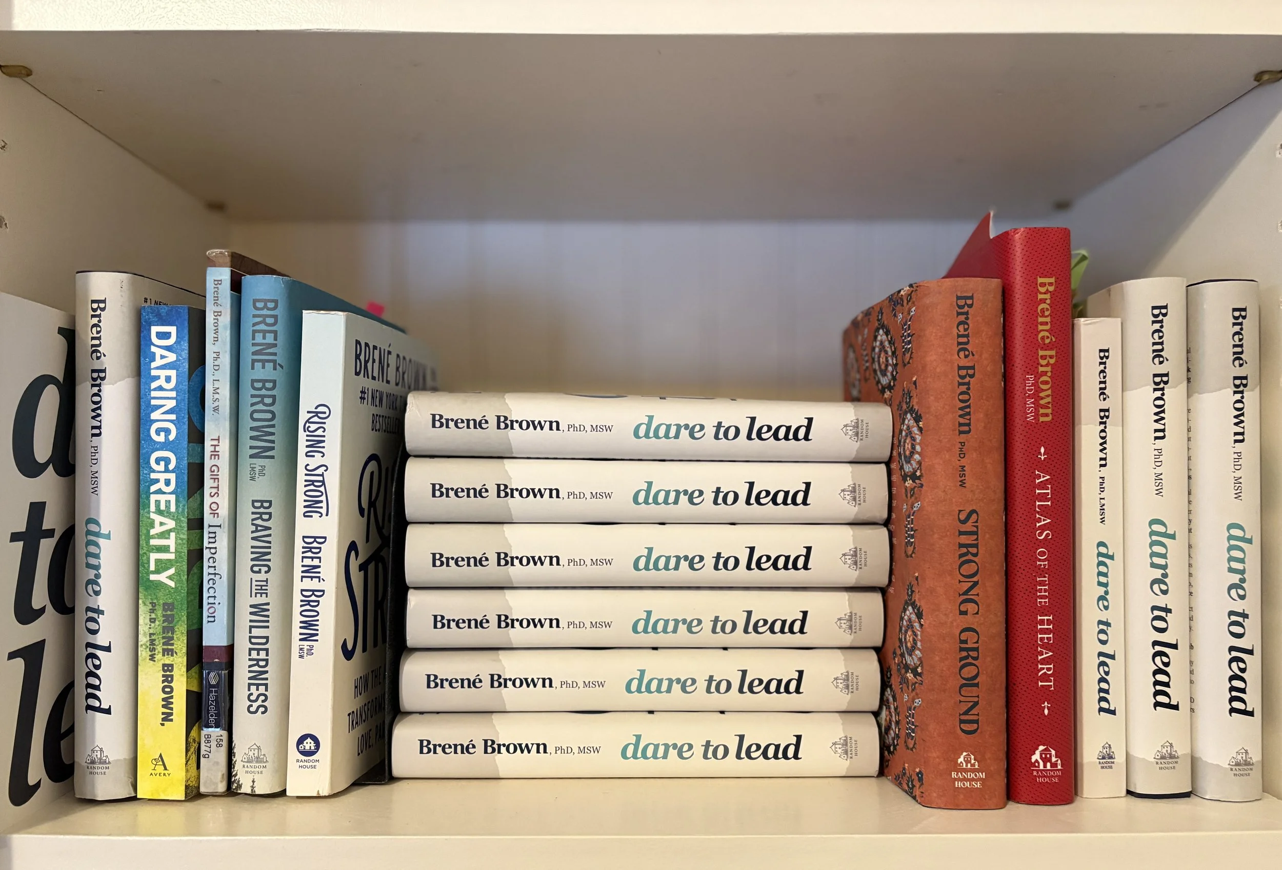 Brene Brown books on bookshelf