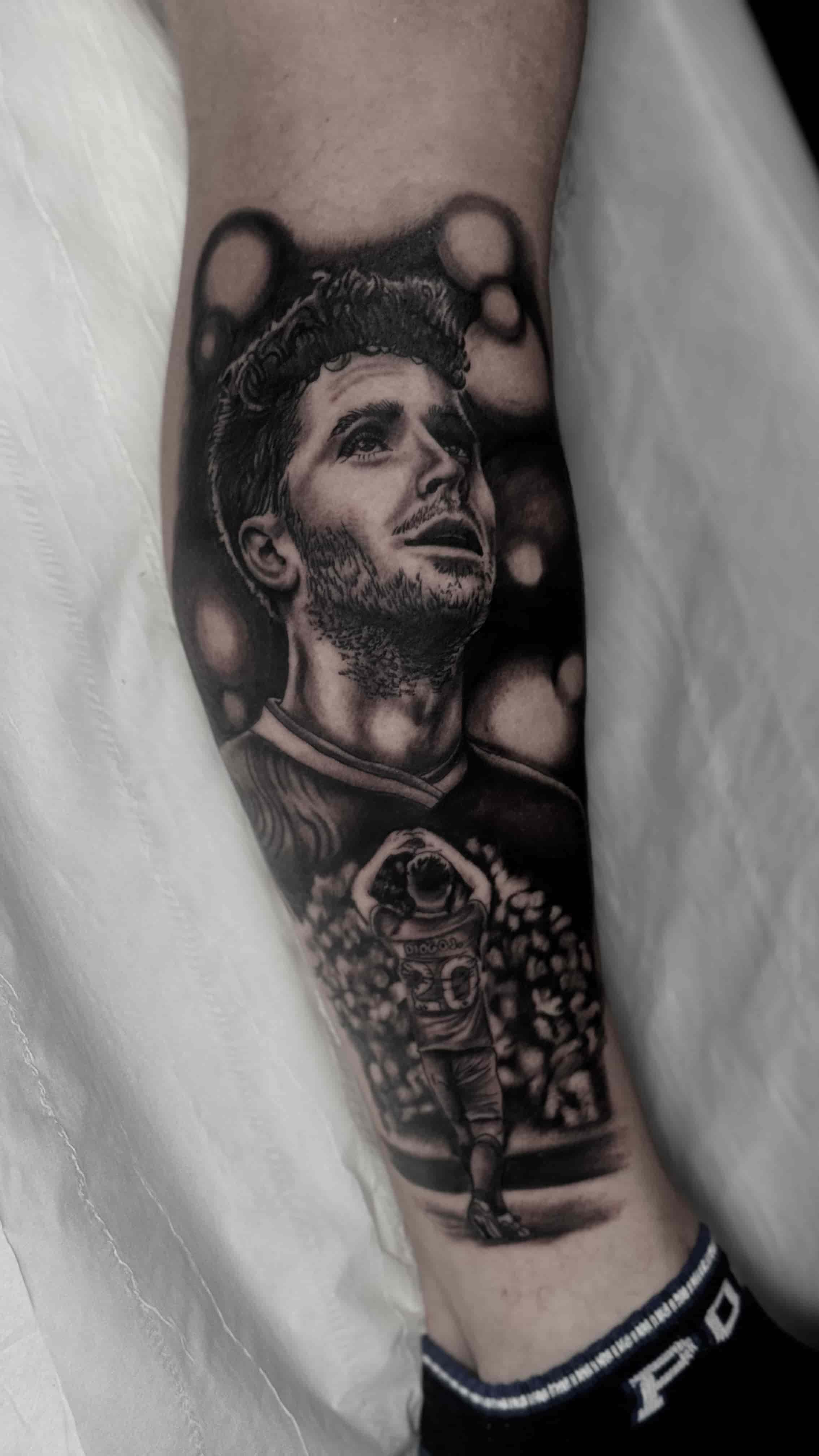 Realism tattoo portrait of Diogo Jota in black and grey