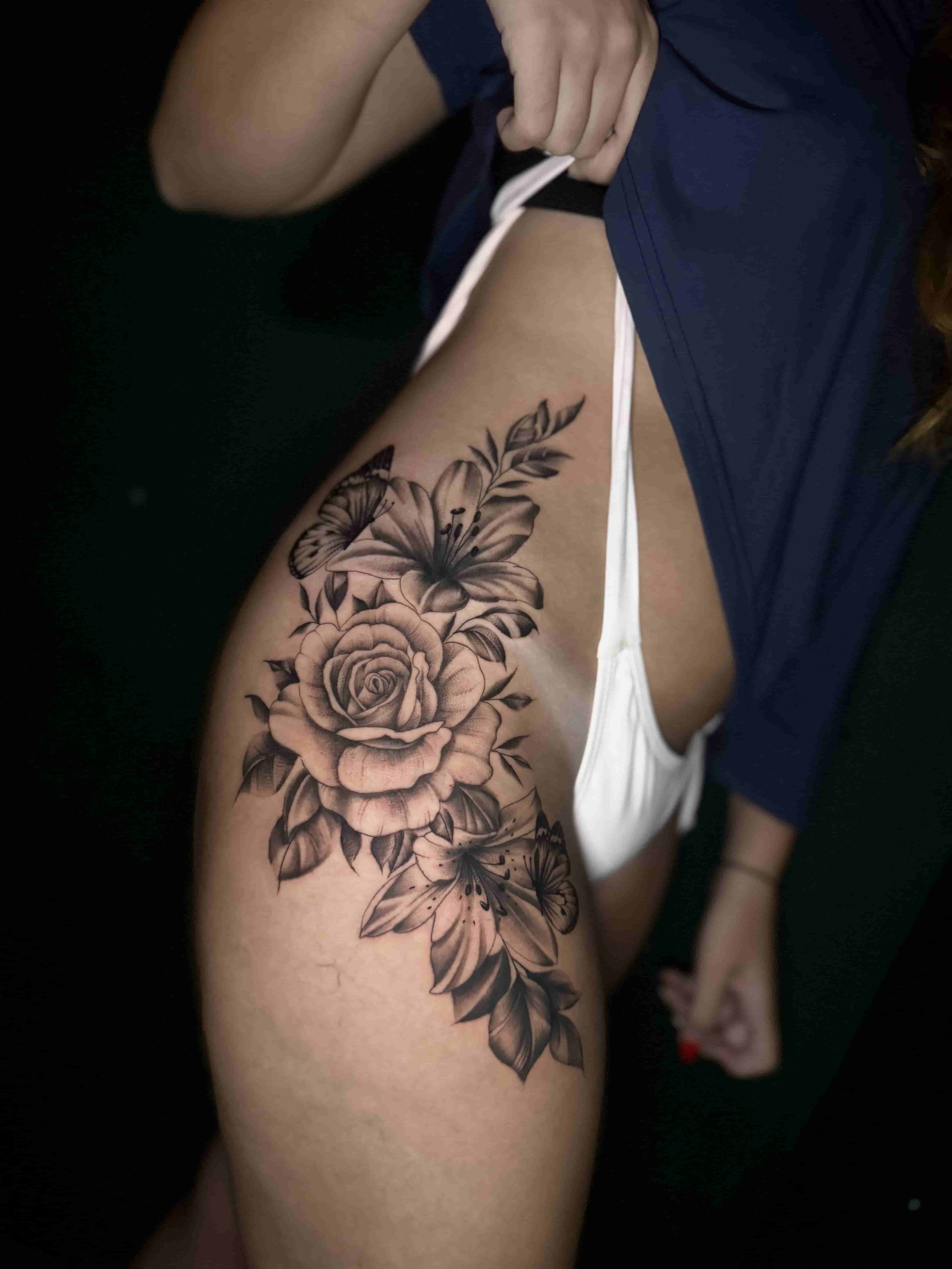 floral thigh tattoo black and grey 