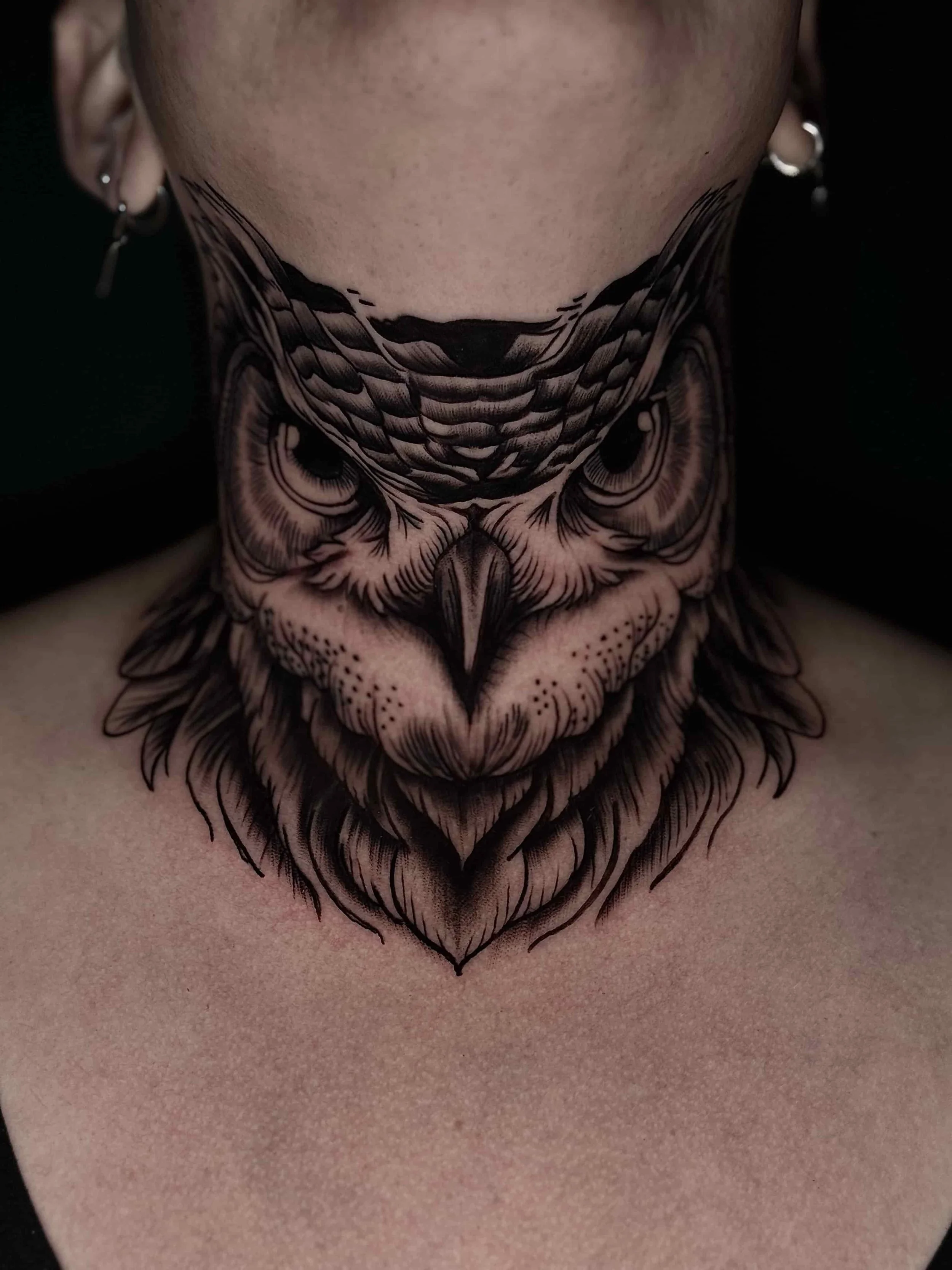 Traditional owl neck tattoo 