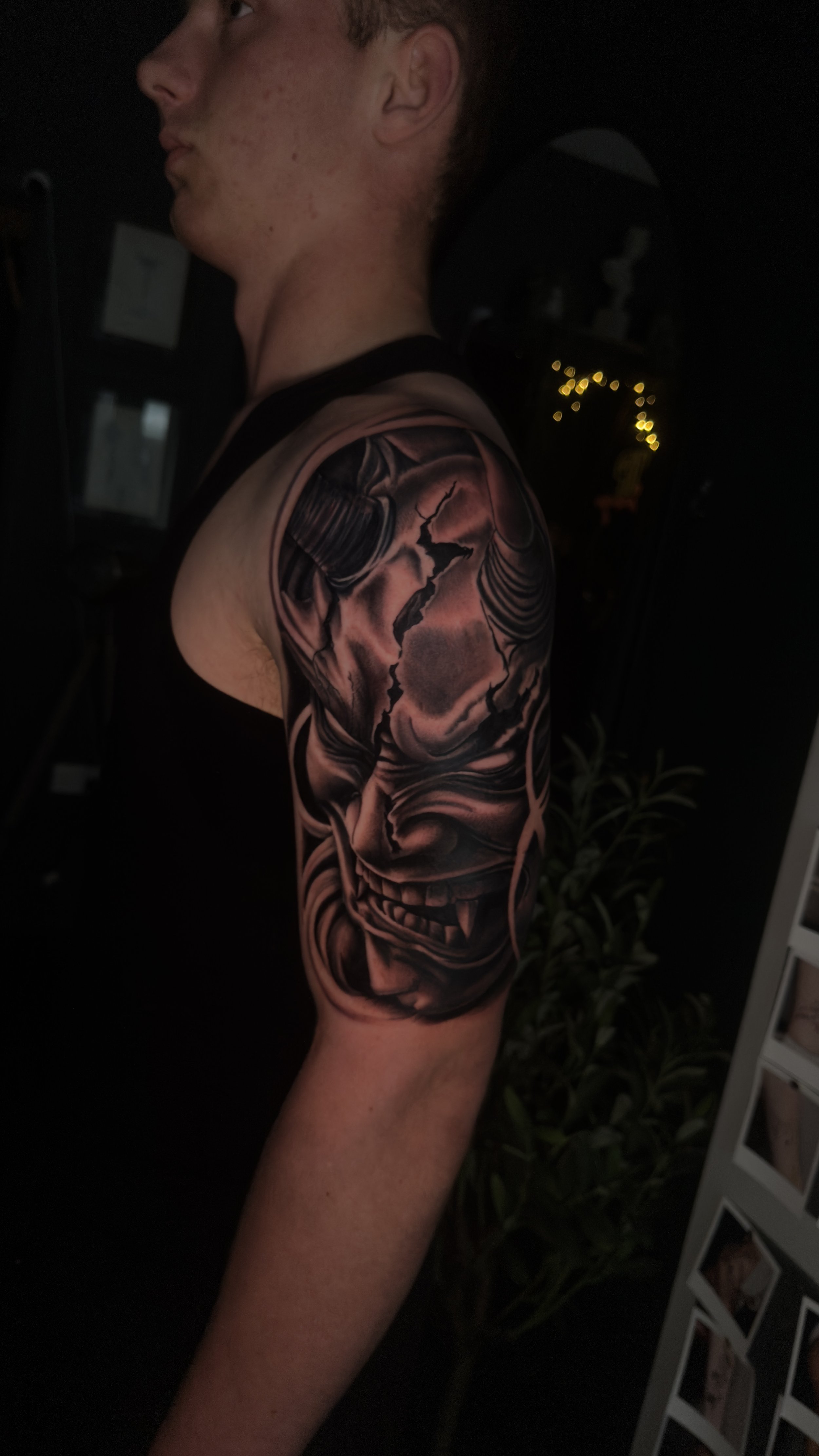 Black and grey realistic Hannya mask tattoo, by Harry Devlin, Devlin Ink Tattoos Colchester.