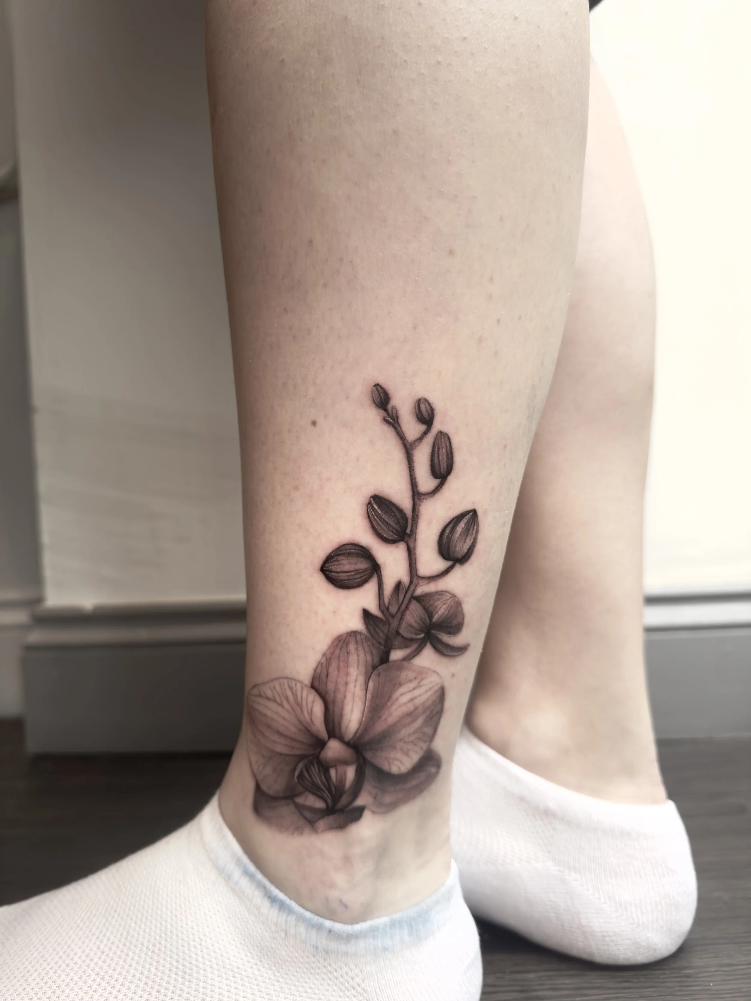 Black and grey realism orchid tattoo, by Vicky Devlin, Devlin Ink Tattoos Colchester