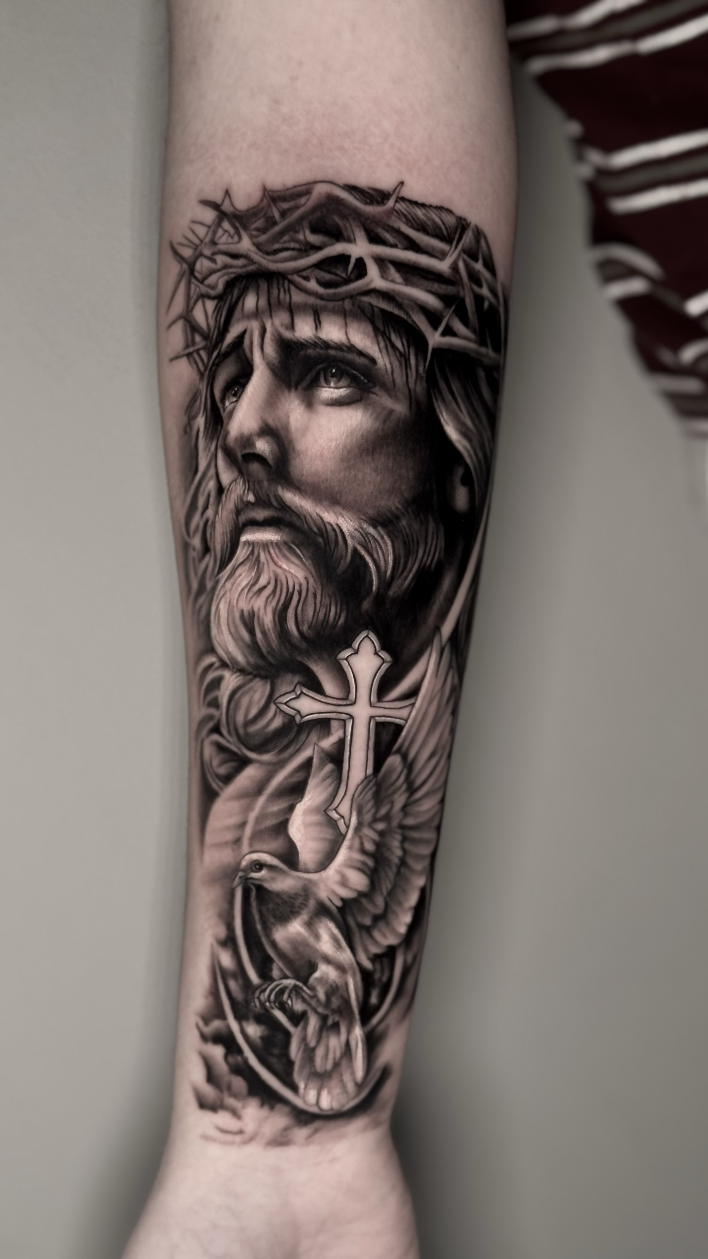 Black and grey realistic Jesus Christ and dove leg tattoo, by Harry Devlin, Devlin Ink Tattoos Colchester
